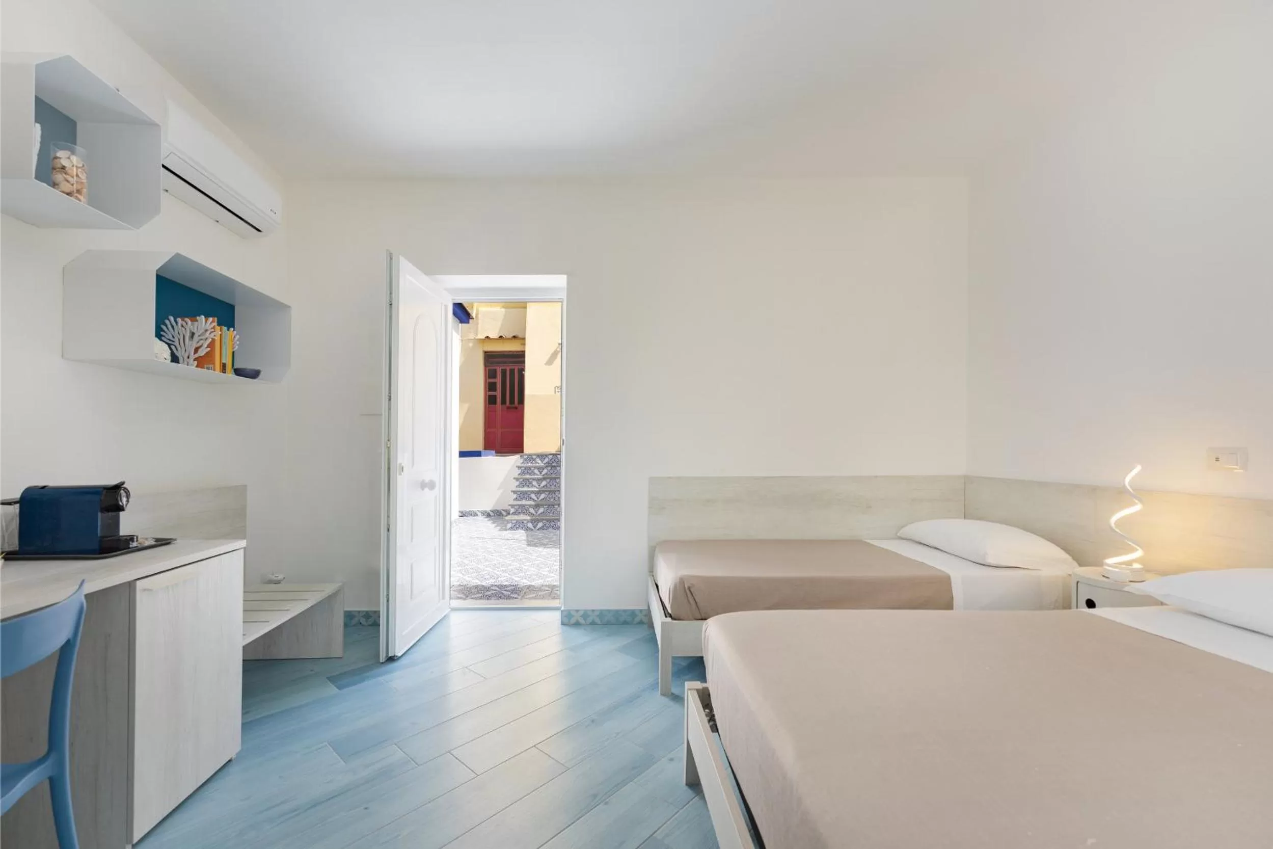 Bed in Poseidonia Rooms