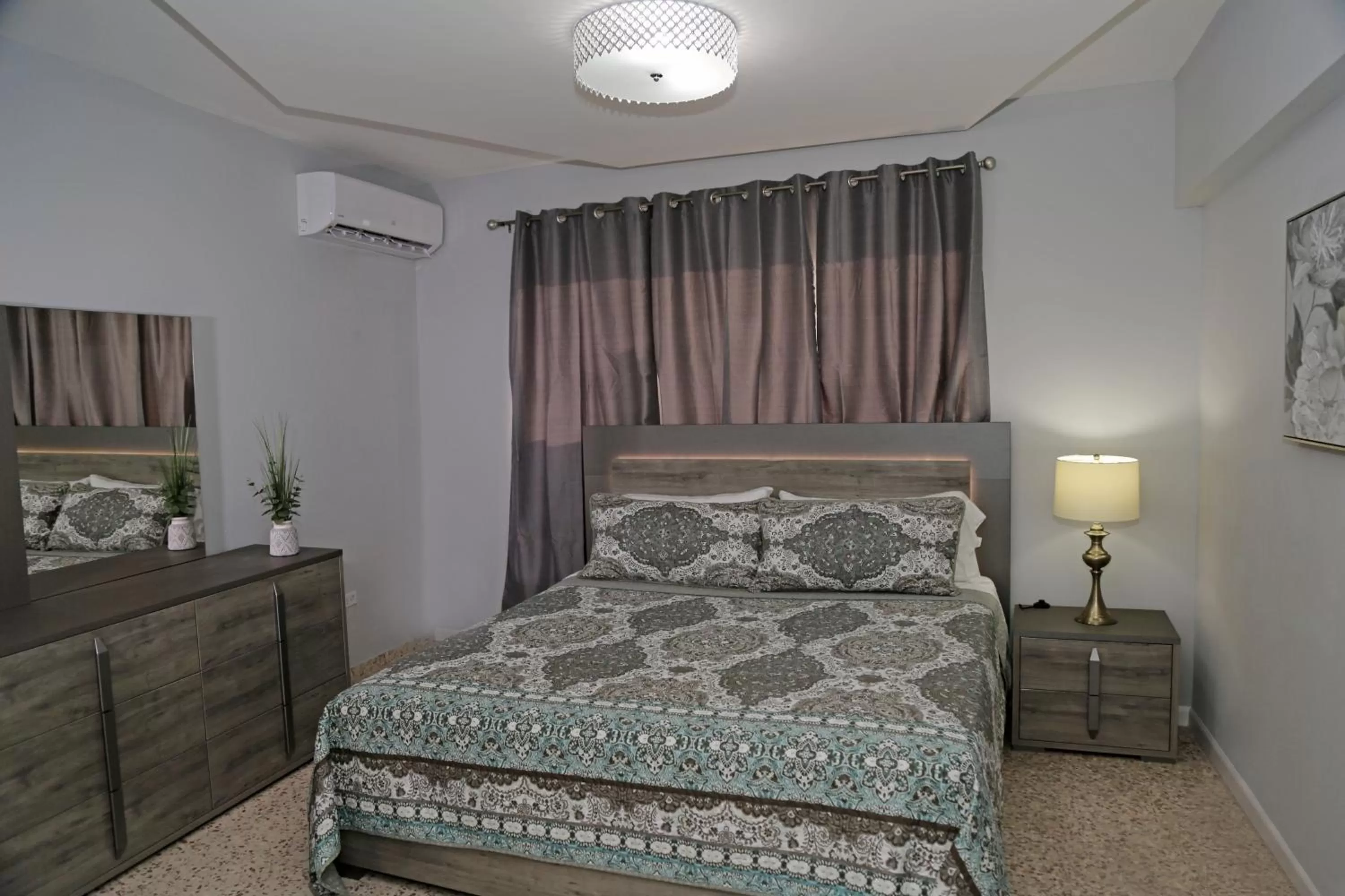 Bed in Itza-Bella Suites