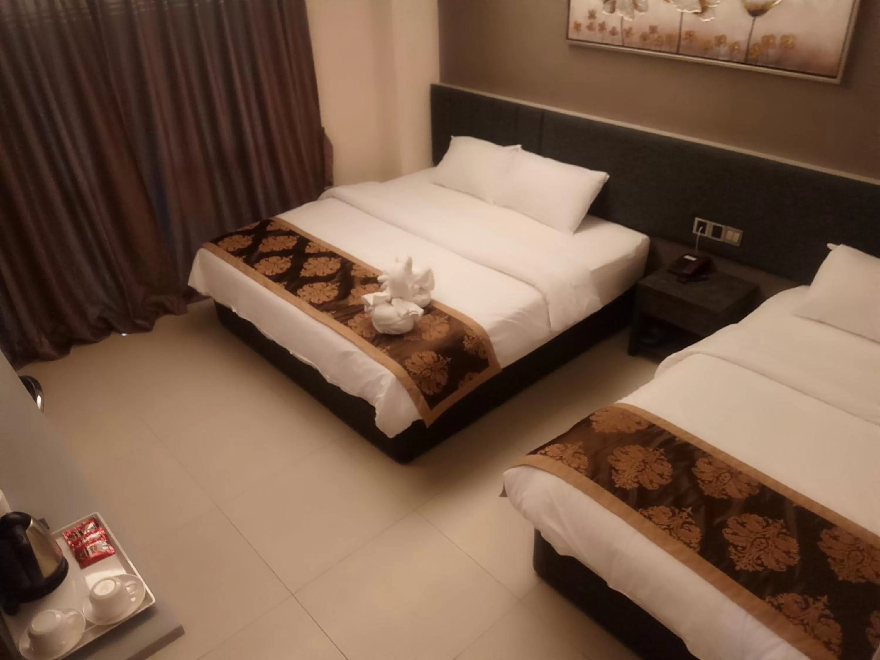 Bed in Golden Leaves Hotel