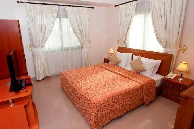 Bed in Safeer Plaza Hotel