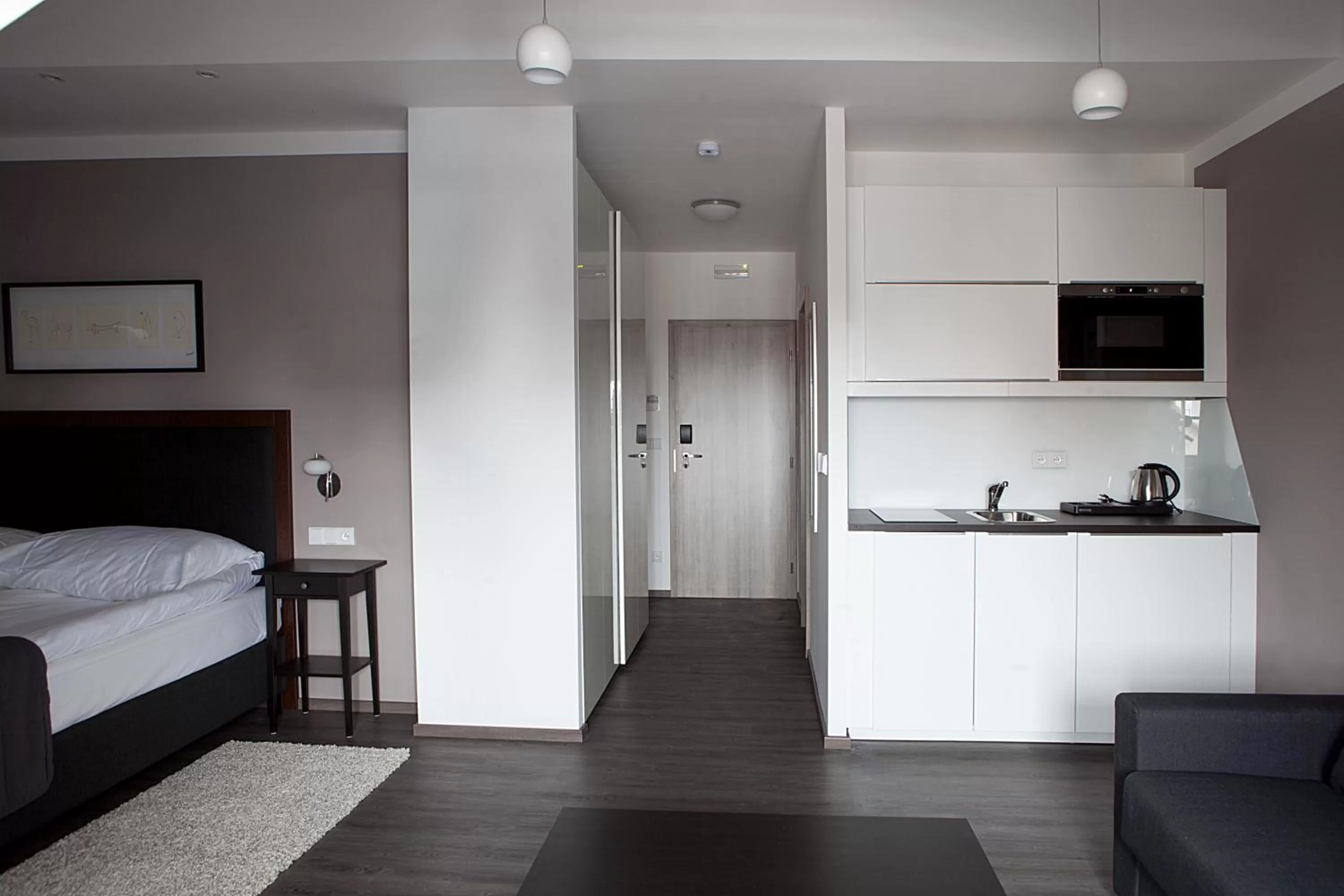 Kitchen or kitchenette, Bed in Hotel Koruna