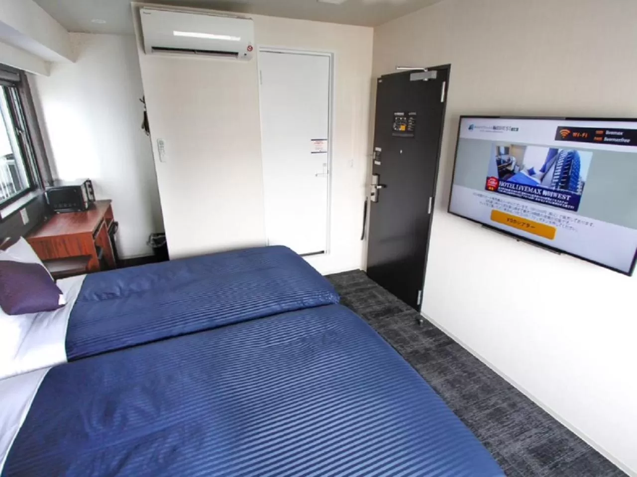 Bed in HOTEL LiVEMAX Umeda WEST