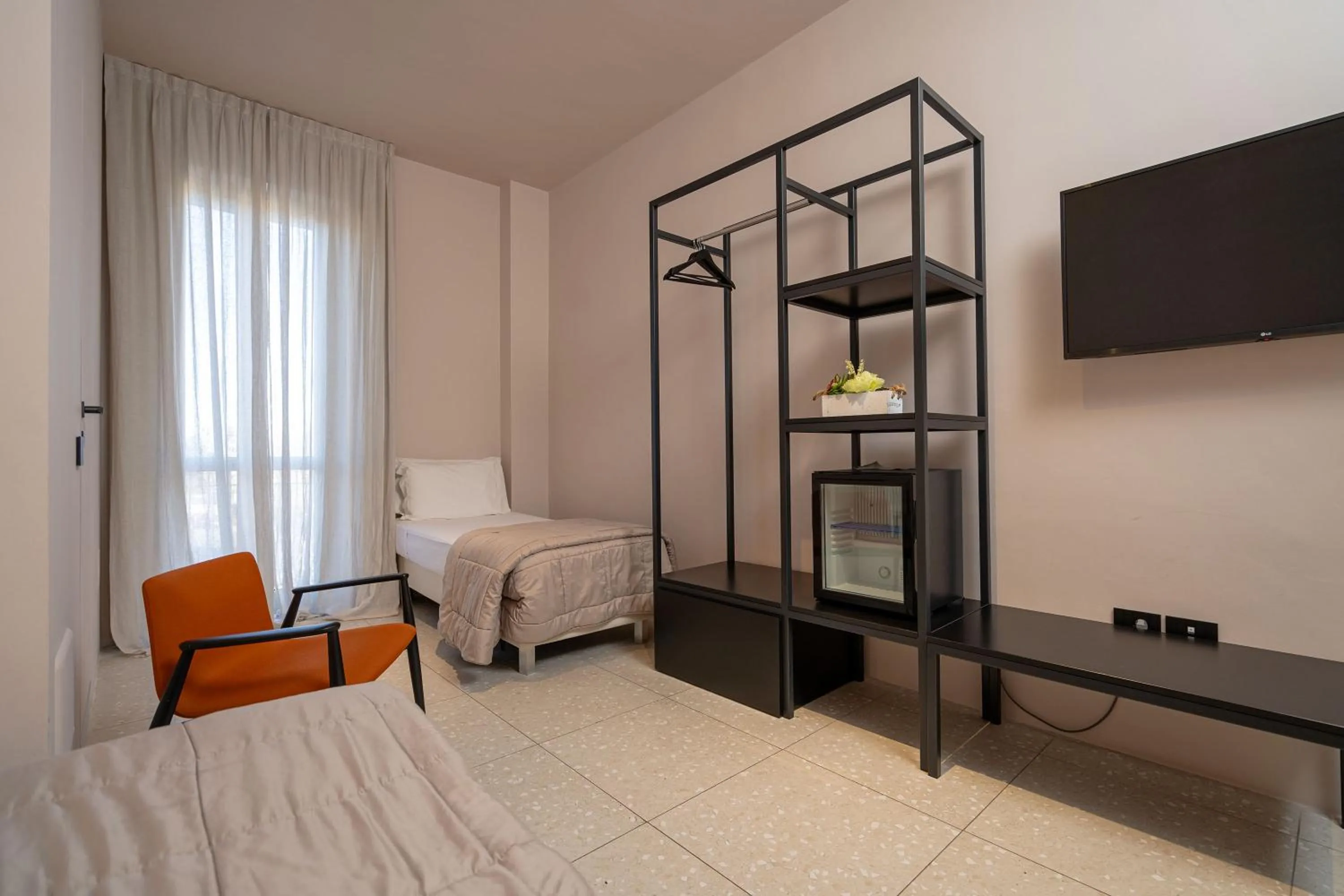 Bed in Elide Design Hotel