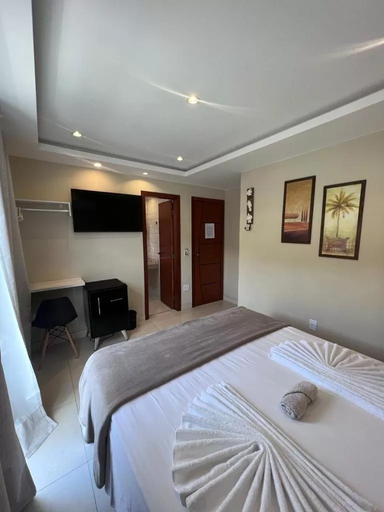 Bed in Pousada Arraial Tropical