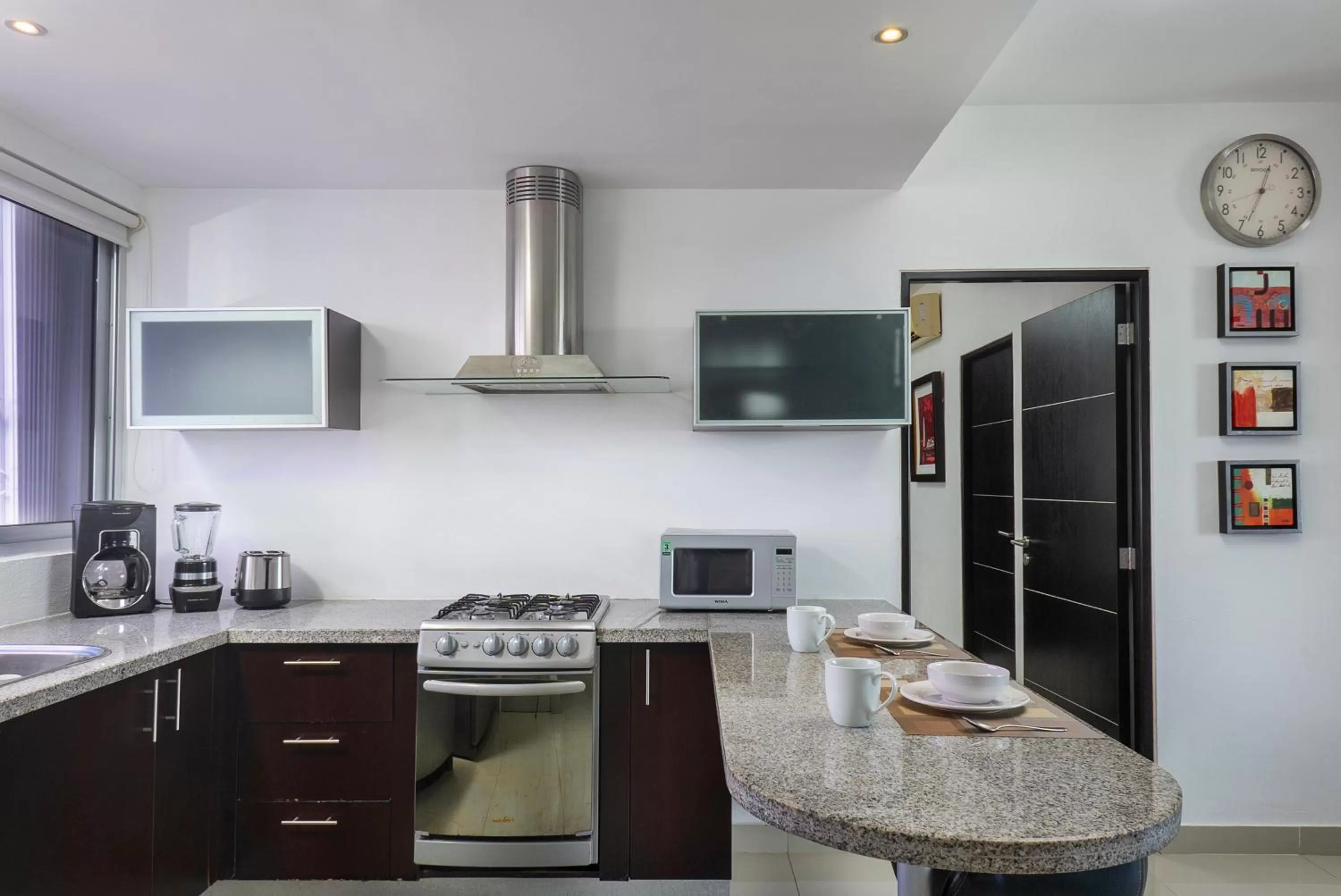 Kitchen or kitchenette in Suites Malecon Cancun