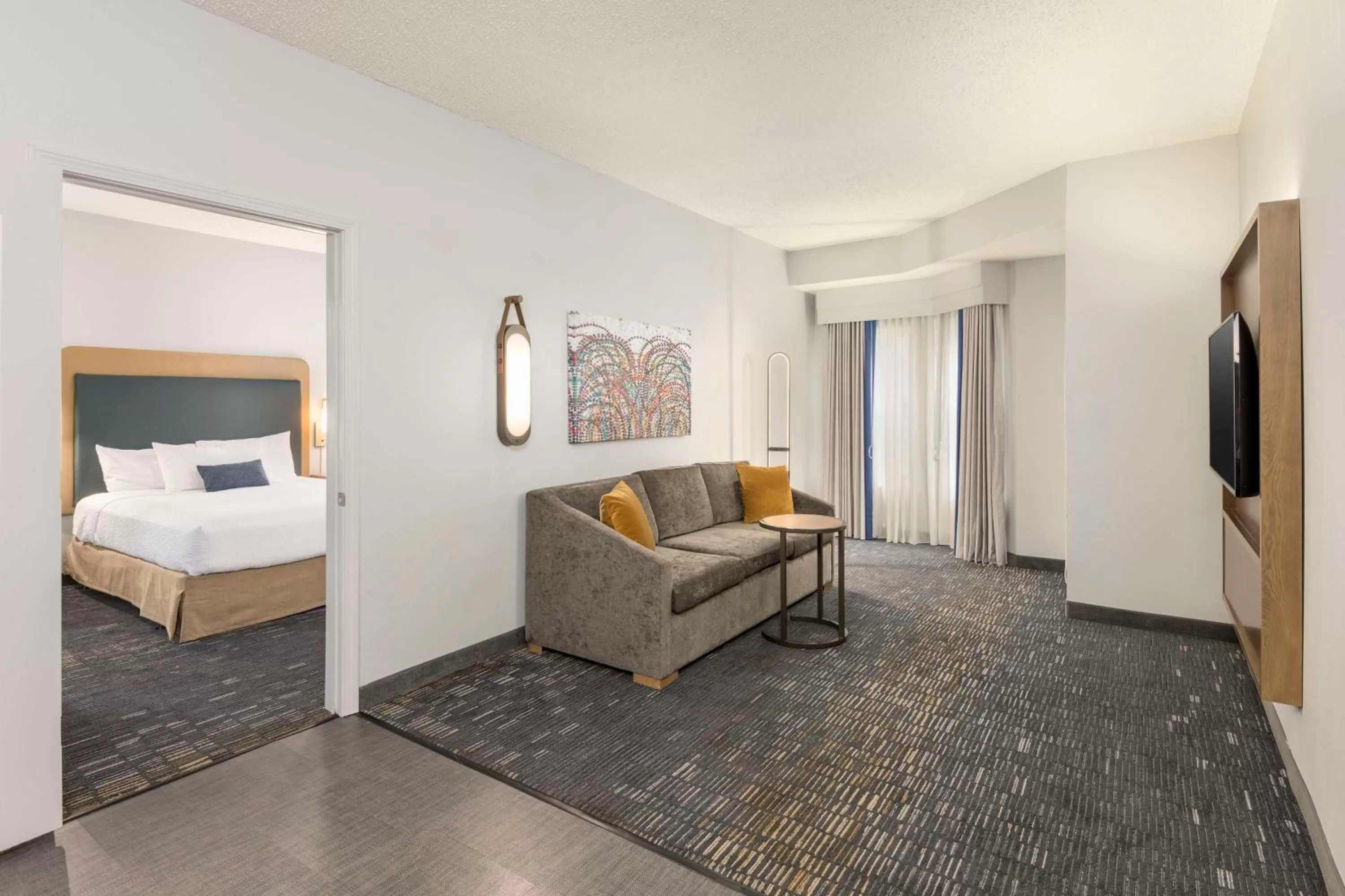 Living room, Bed in Homewood Suites by Hilton New Orleans