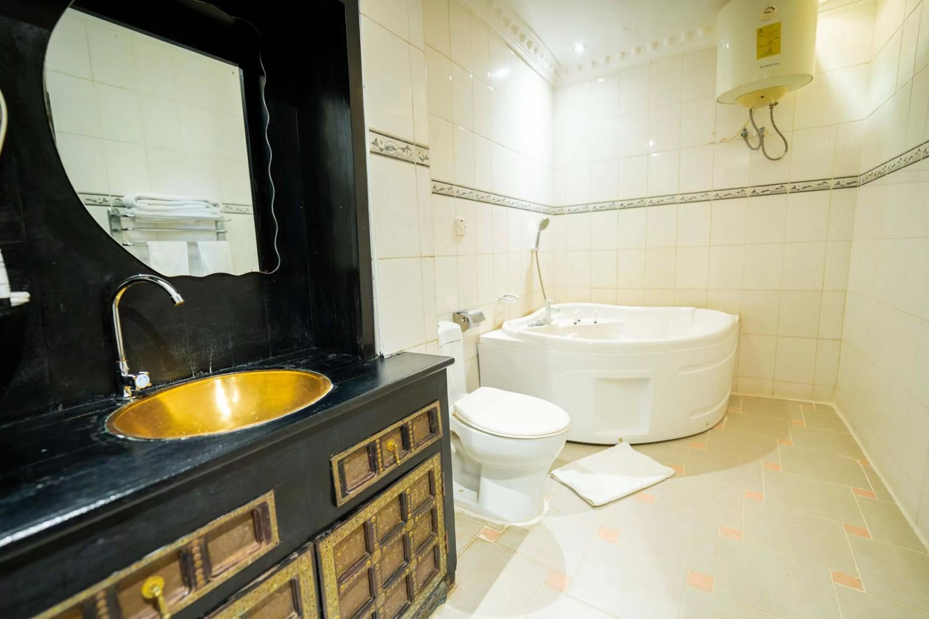 Toilet in Golden Tulip Stone Town Boutique