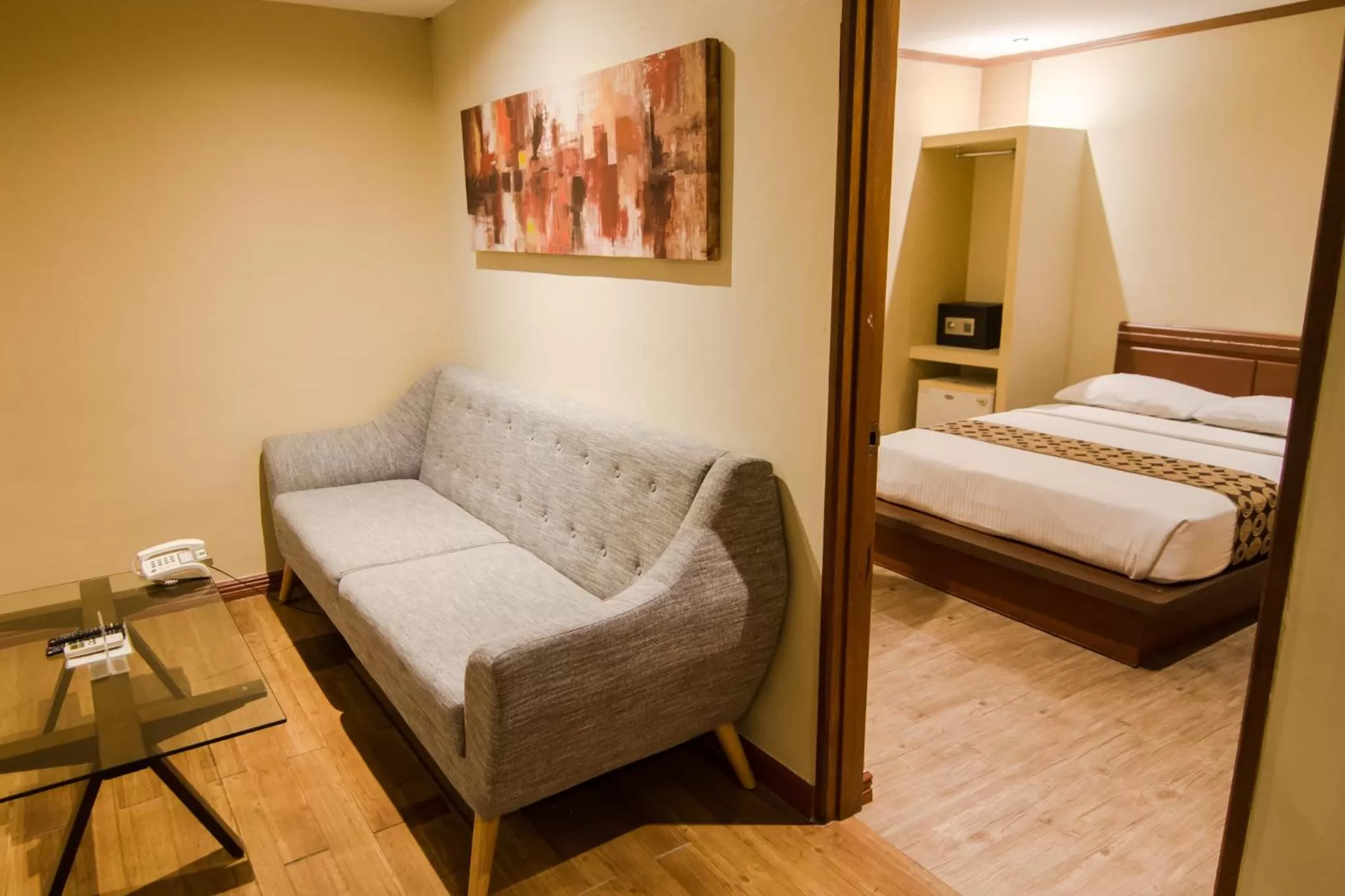 Seating area, Bed in DG Grami Hotel