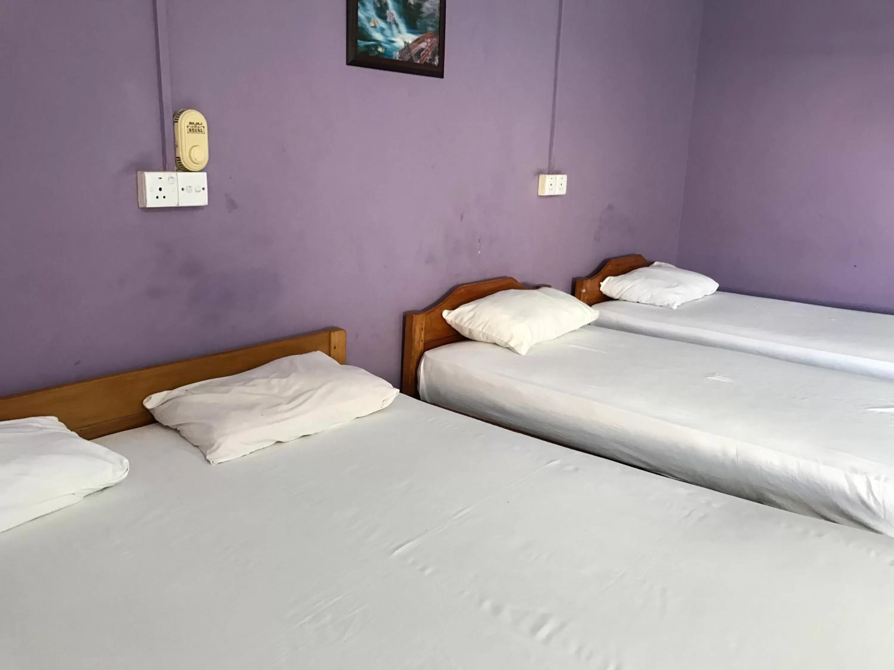 Bed in Gnaanams Hotel and Restaurant