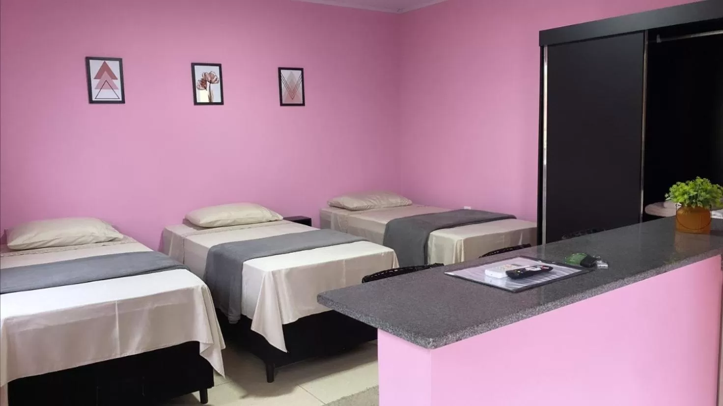 Bed in Pousada Mercosul