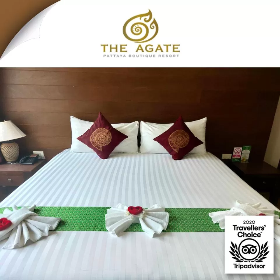 Bed in The Agate Pattaya Boutique Resort