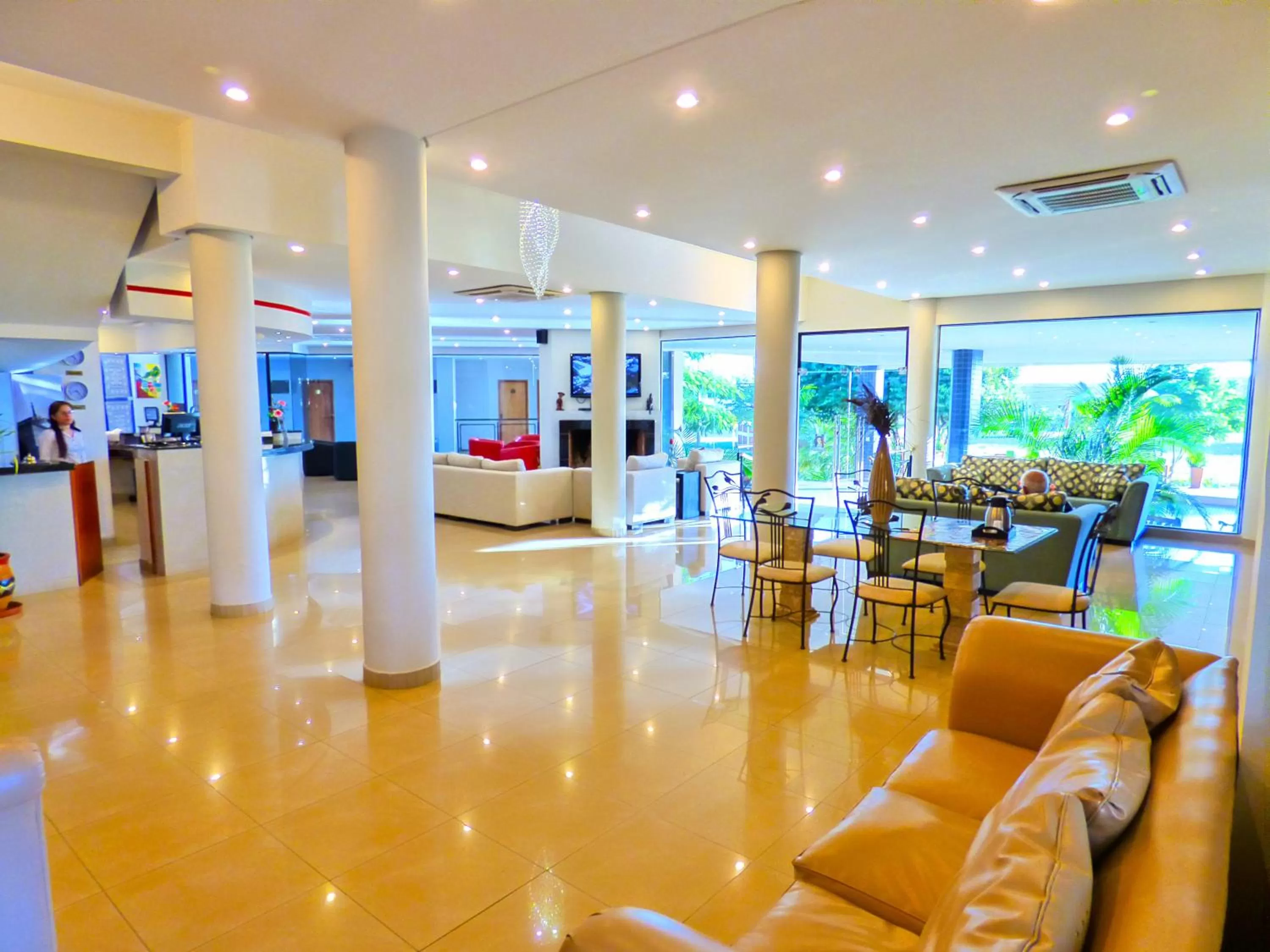 Communal lounge/ TV room in De La Costa Hotel