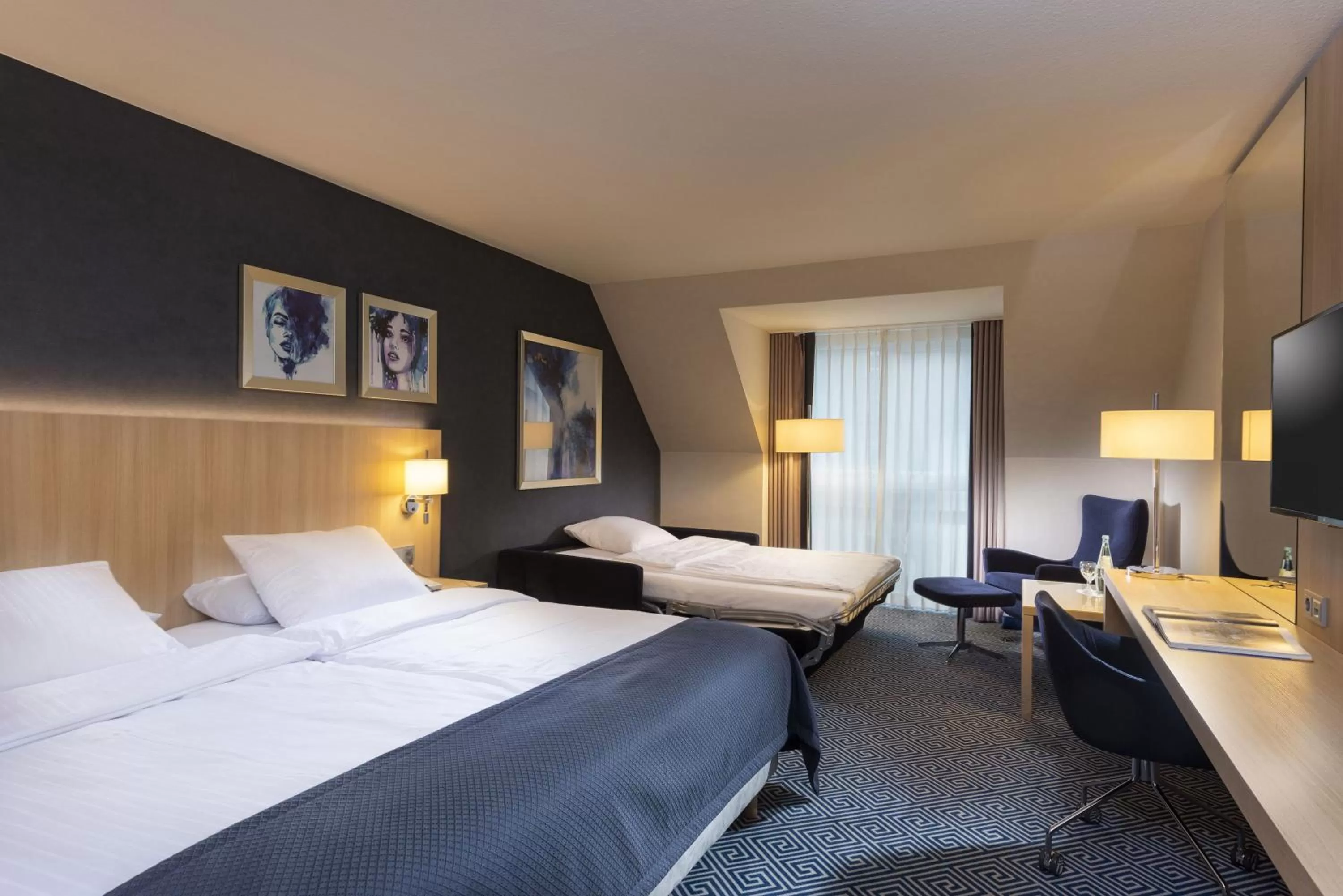 Photo of the whole room, Bed in Maritim Hotel Würzburg