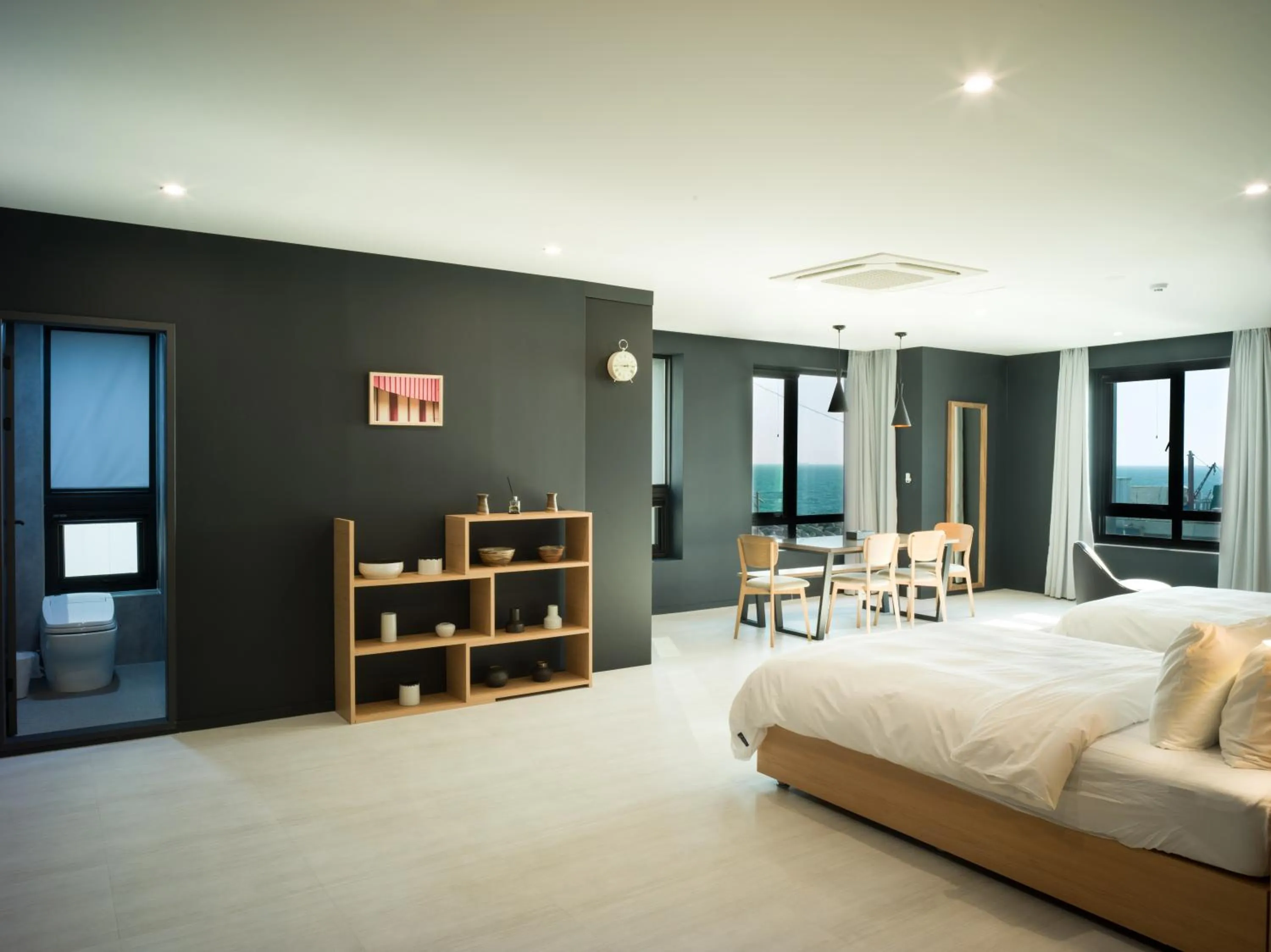 Bed in Mipo Oceanside Hotel