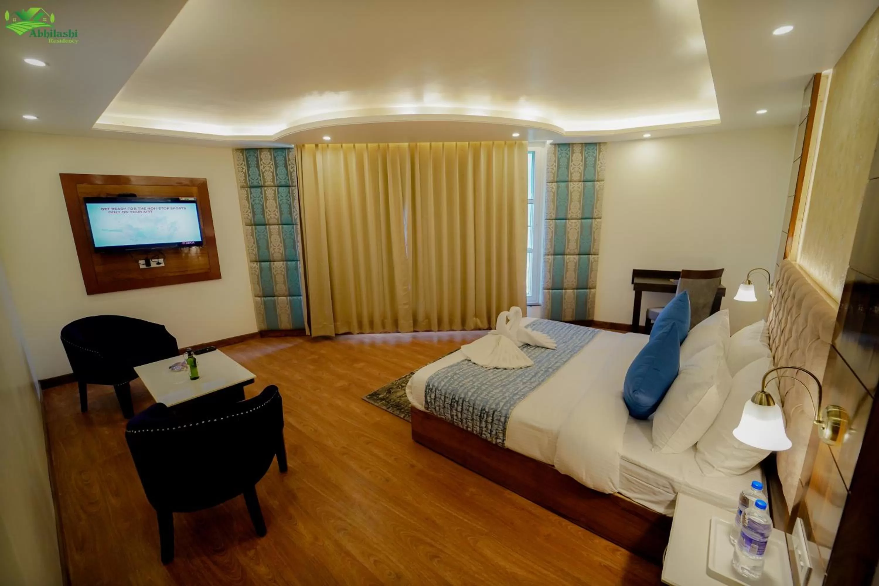 Photo of the whole room, Bed in Abhilashi Residency & Spa - Centrally Heated & Air Cooled