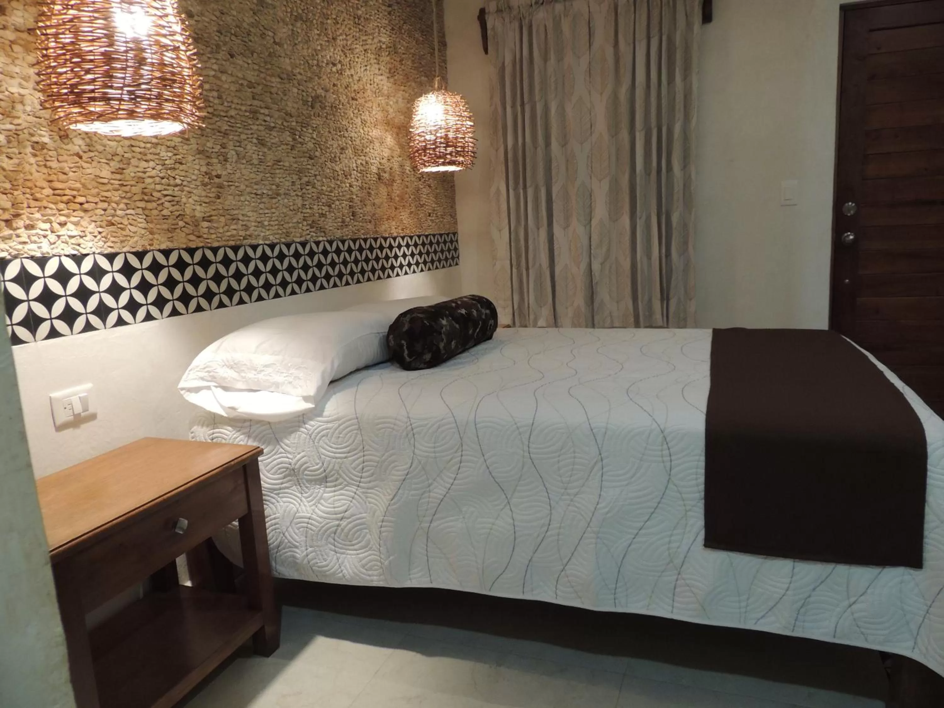 Bed in Hotel Boutique Bugambilias