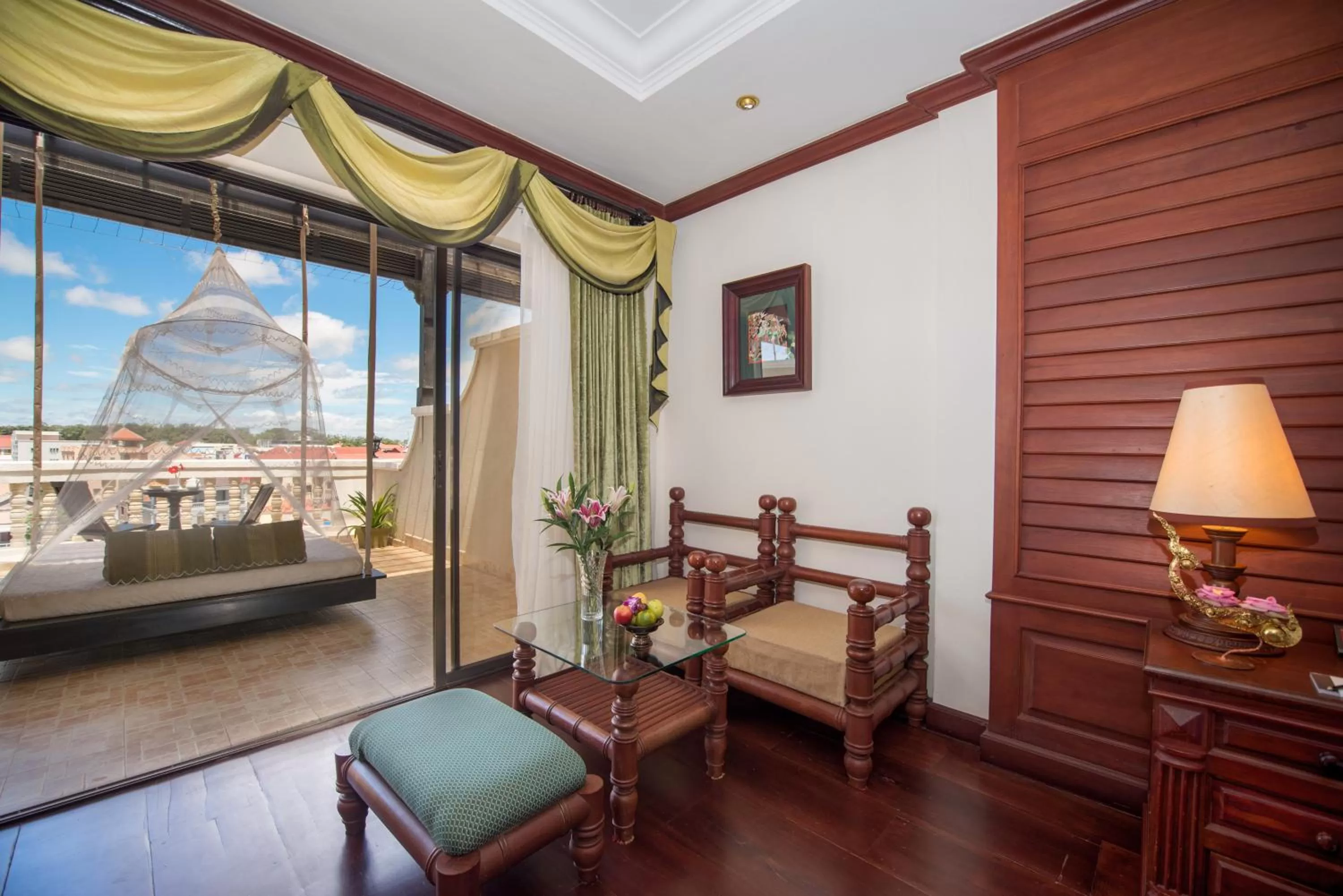 Seating area, Bed in THE PRIVILEGE FLOOR by Borei Angkor