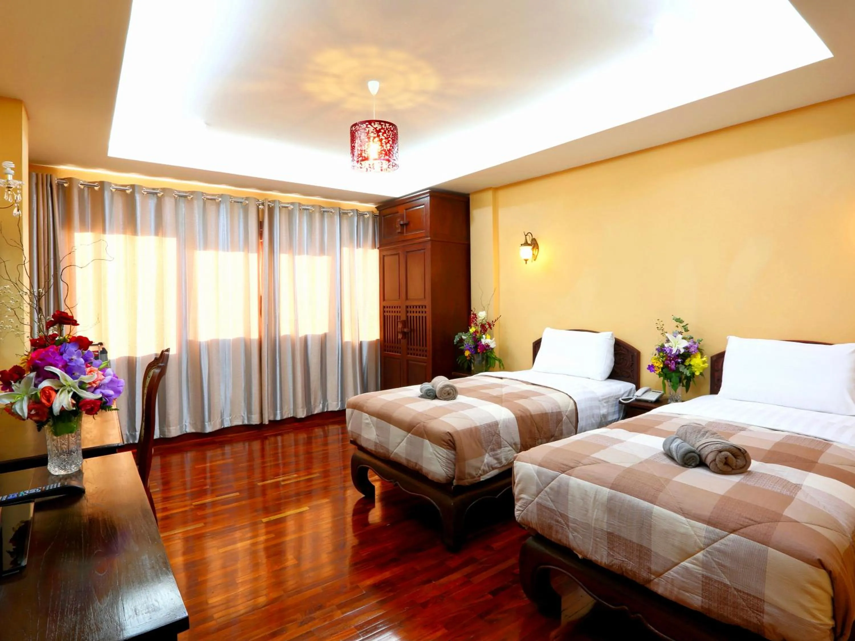 Photo of the whole room, Bed in At Chiang Mai Hotel