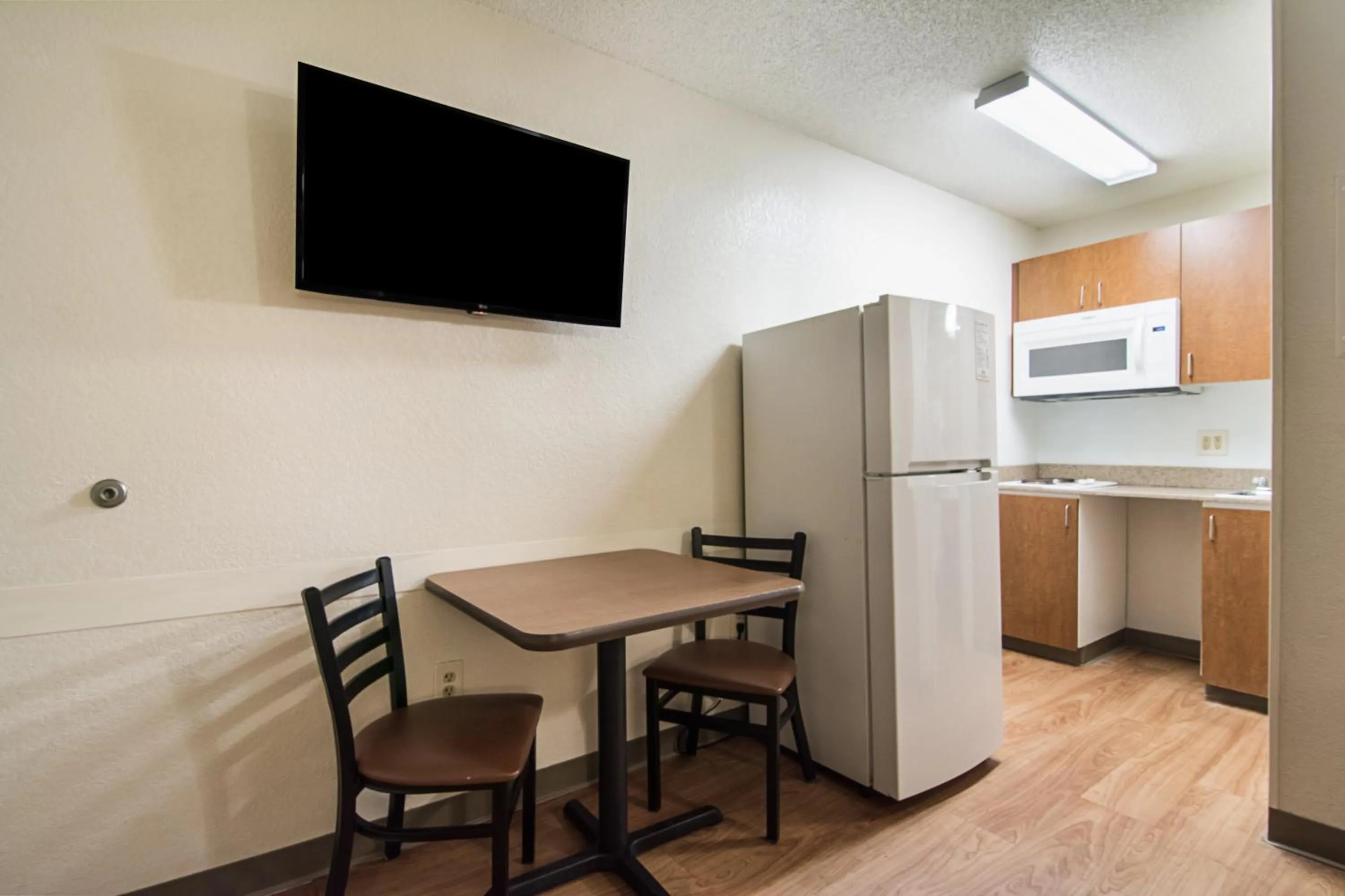 Photo of the whole room in HomeTowne Studios by Red Roof Raleigh – Durham