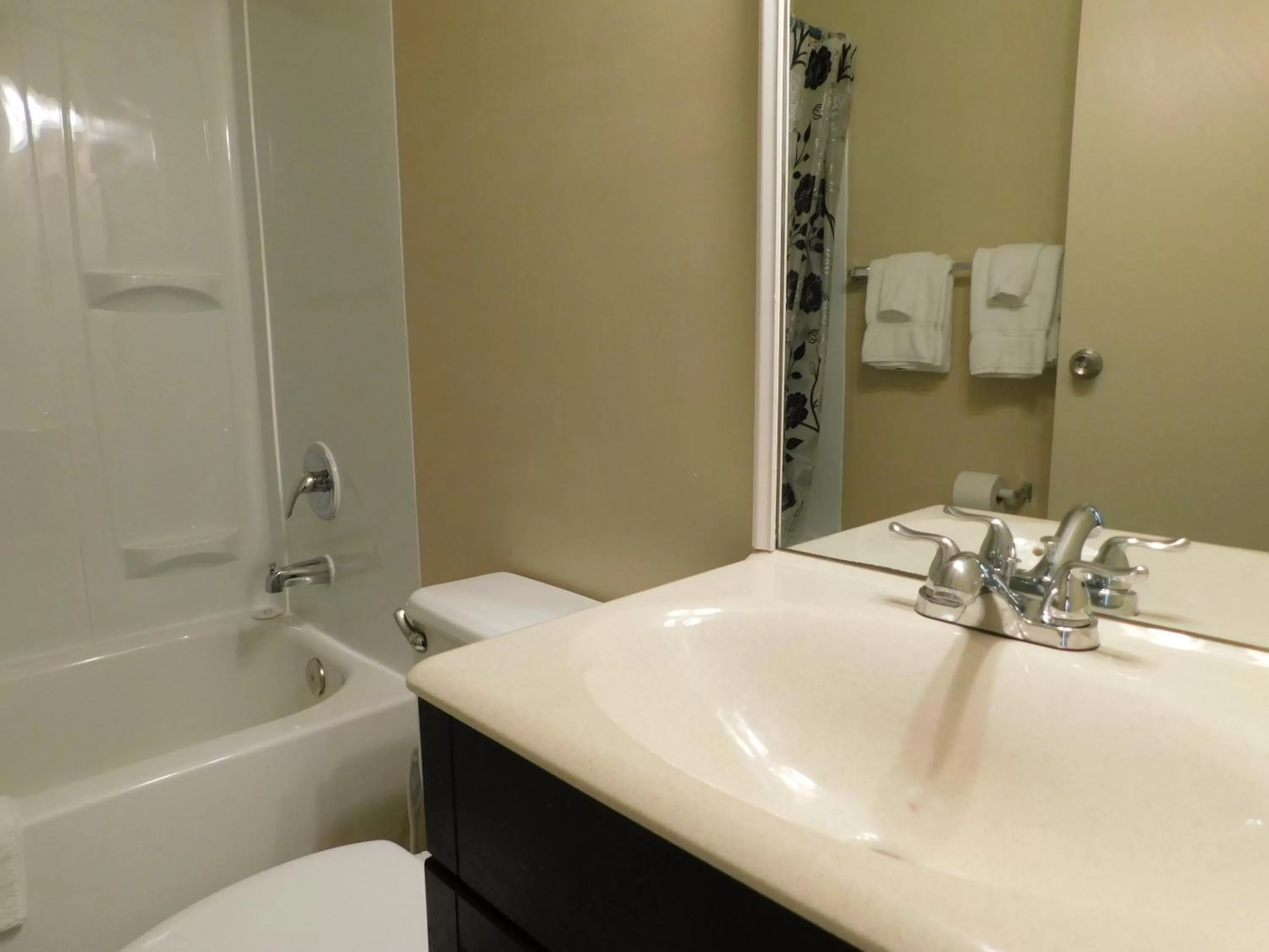 Bathroom in APM Inn and Suites
