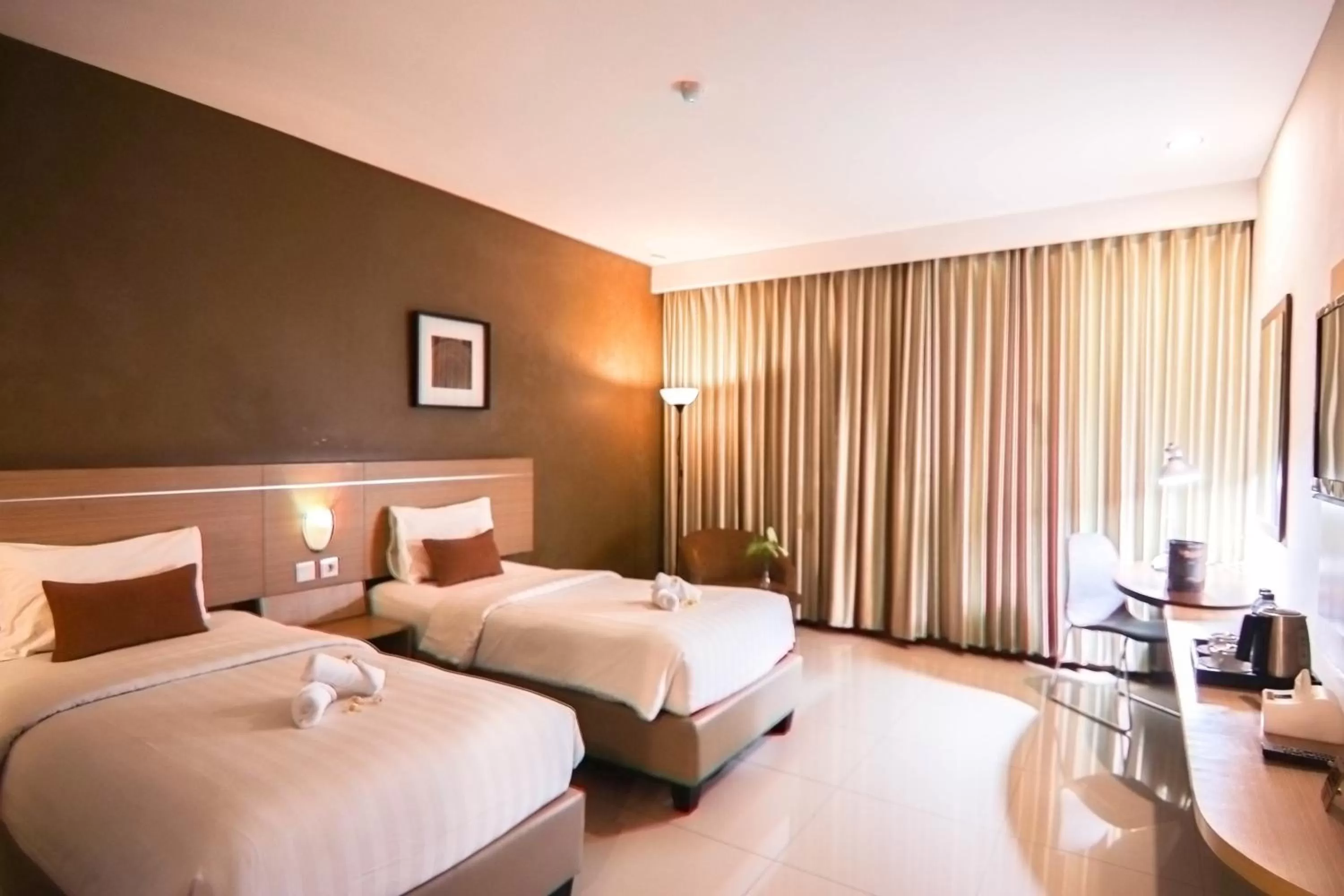 Bed in De Laxston Hotel Yogyakarta, Azana Hotels Collection