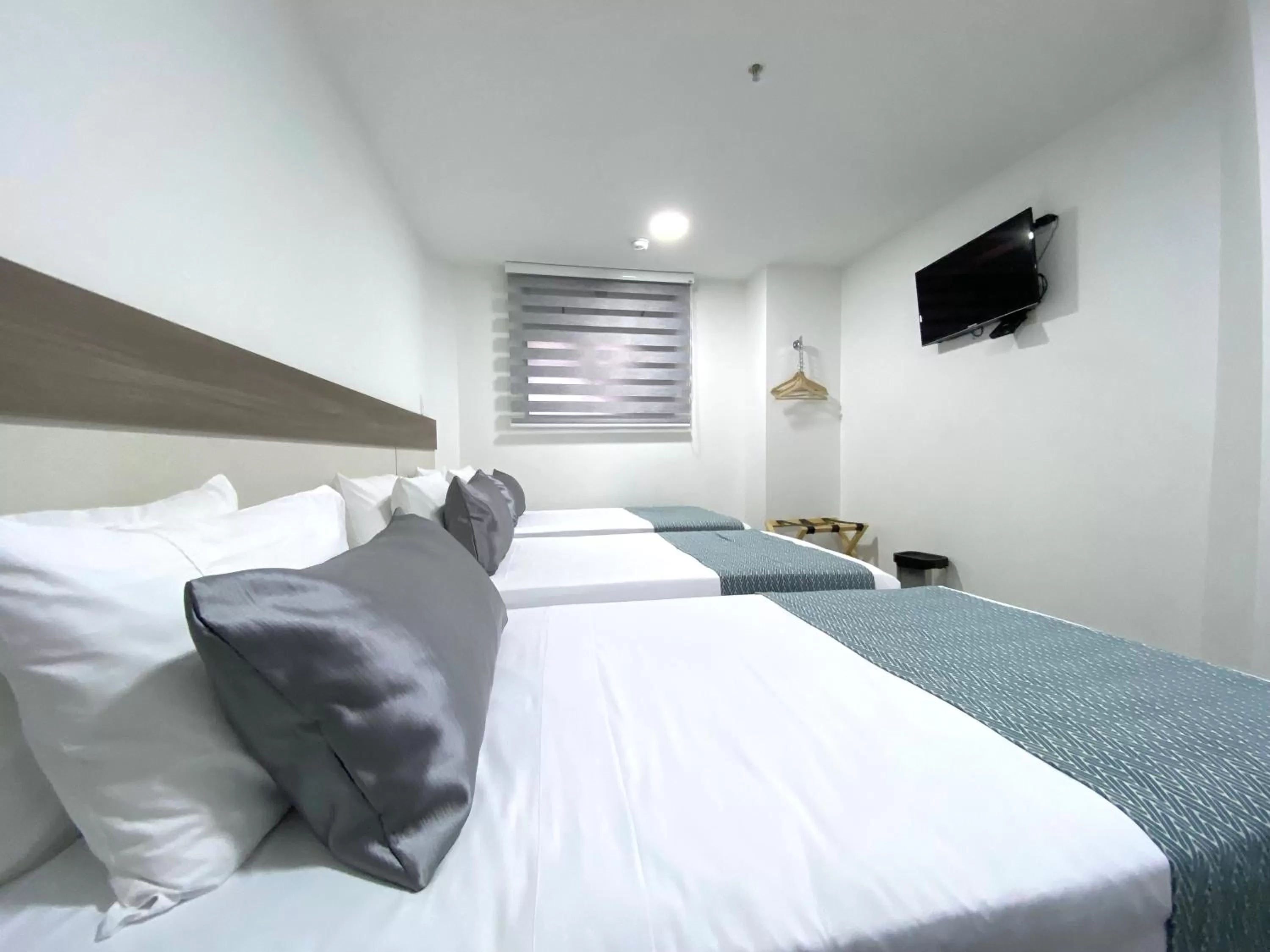 Bed in Seven Inn Hotel