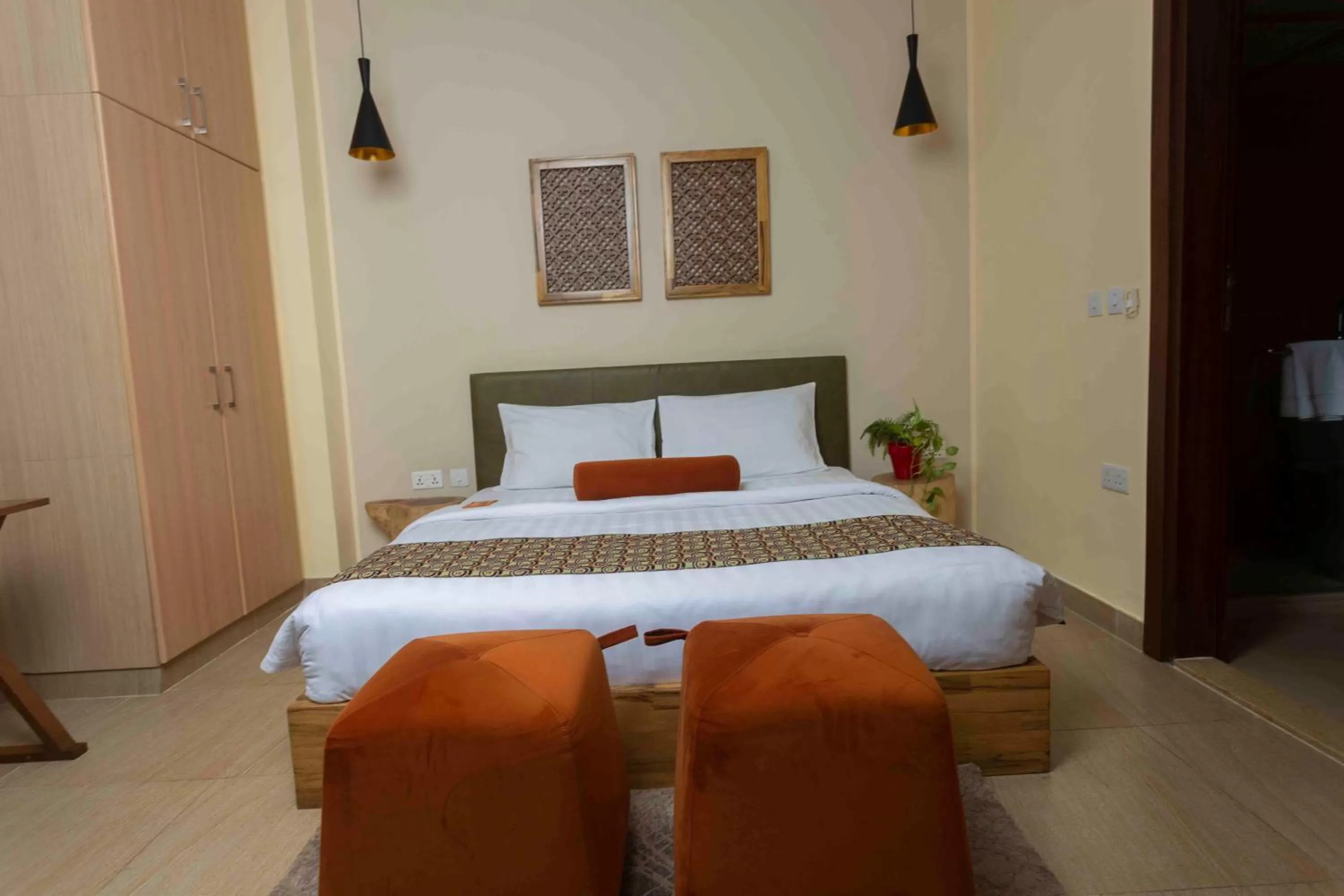 Bed in Roots Hotel Apartment