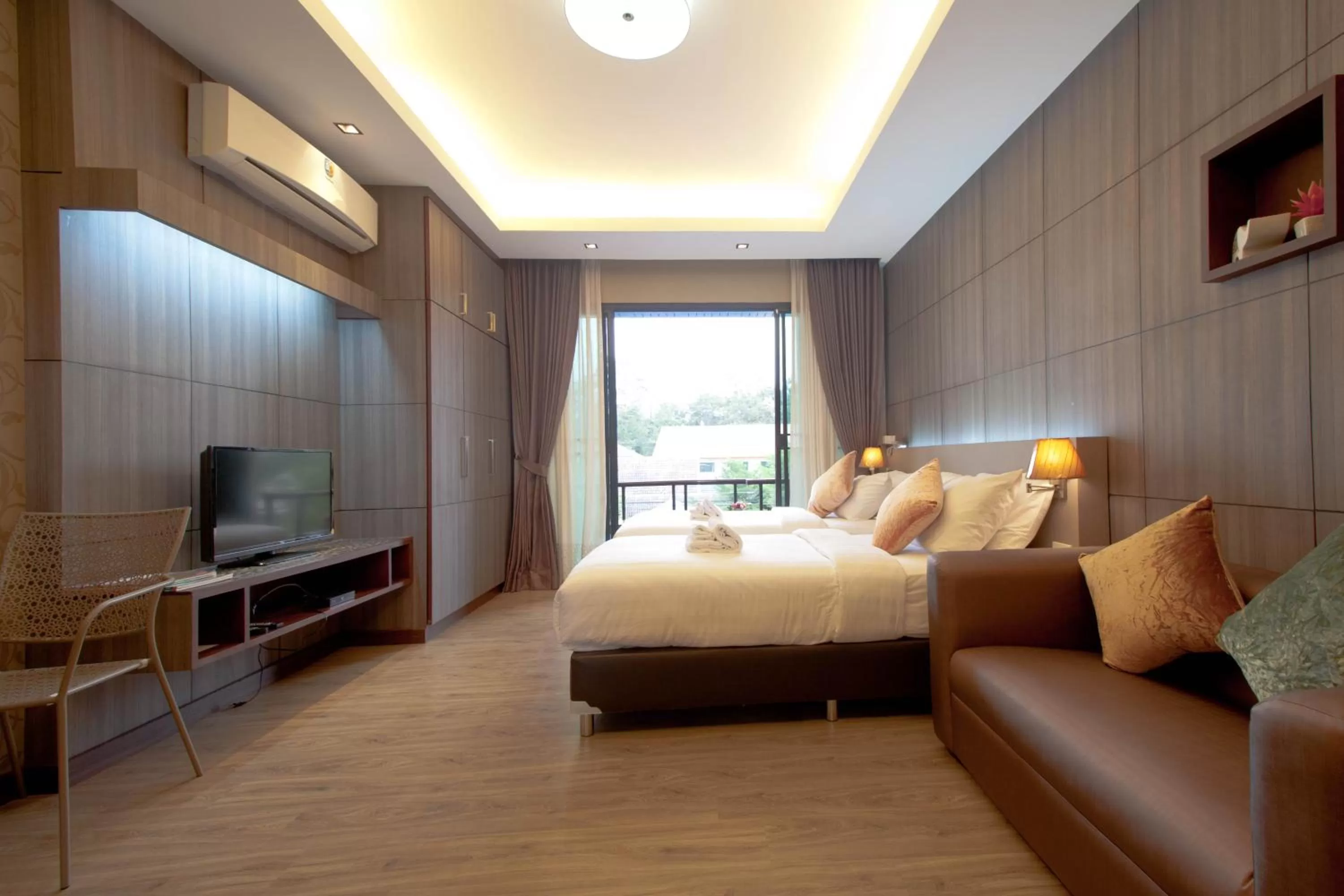 Photo of the whole room, Bed in Burapa Boutique