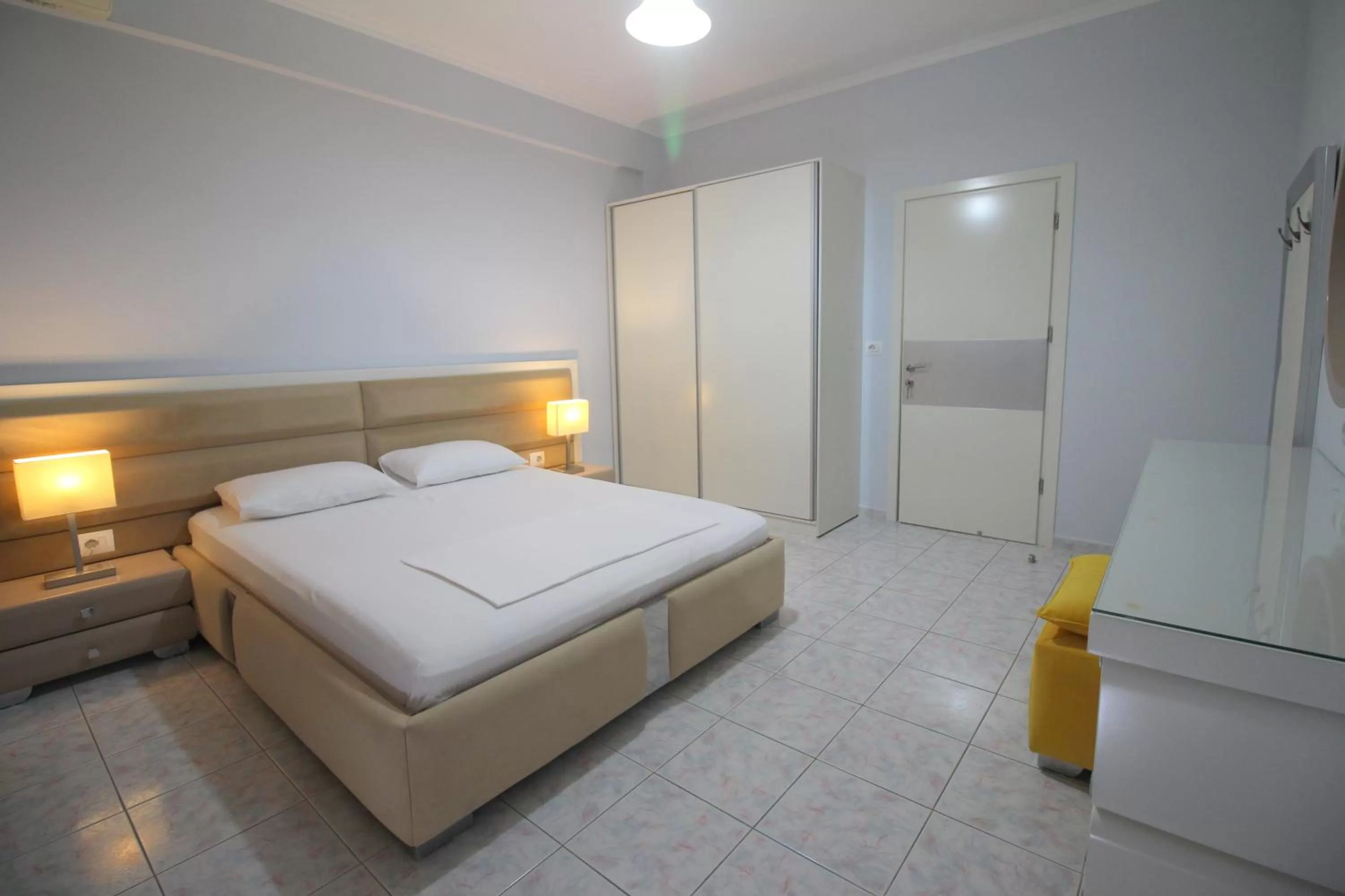 Bed in Murati Suites Sarandë