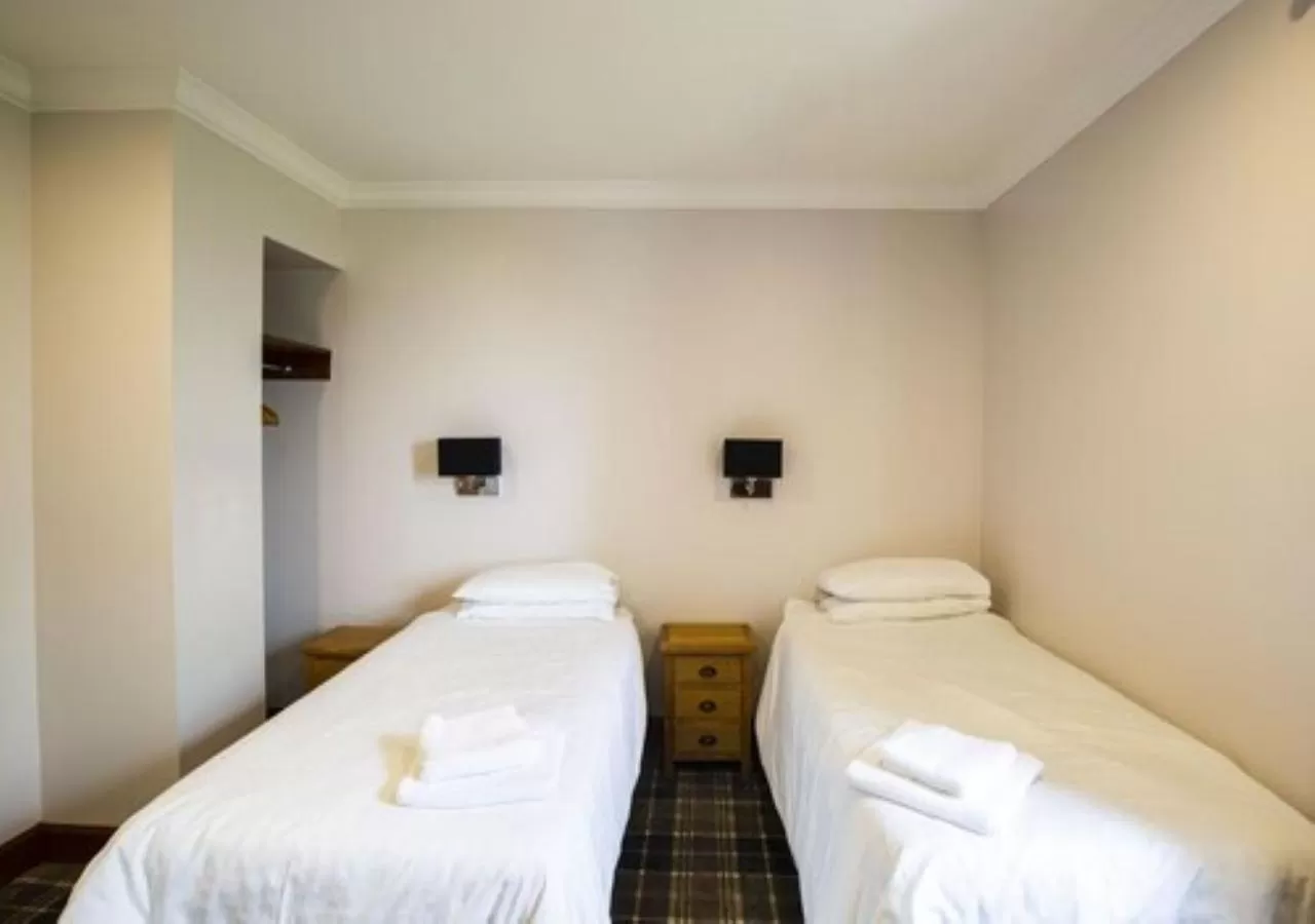 Bed in GOLF View Hotel & Macintosh Restaurant