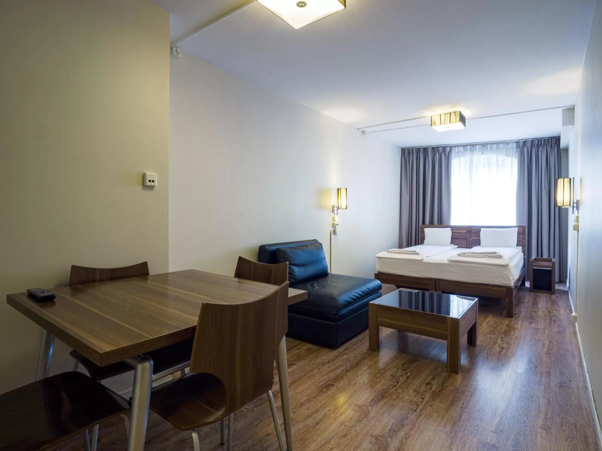 Bed in Central City Apartments