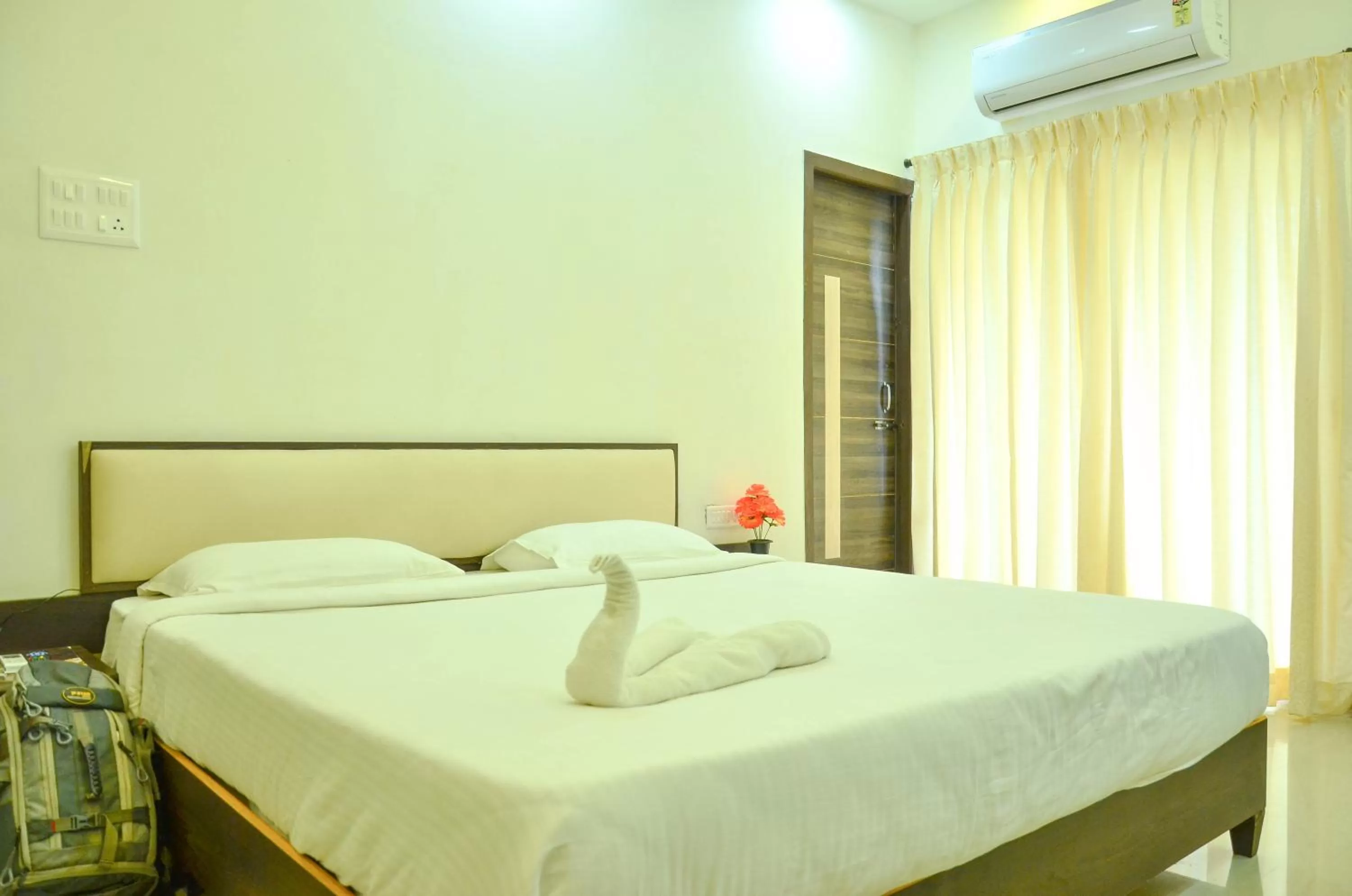 Bed in Hotel Ambai Grand