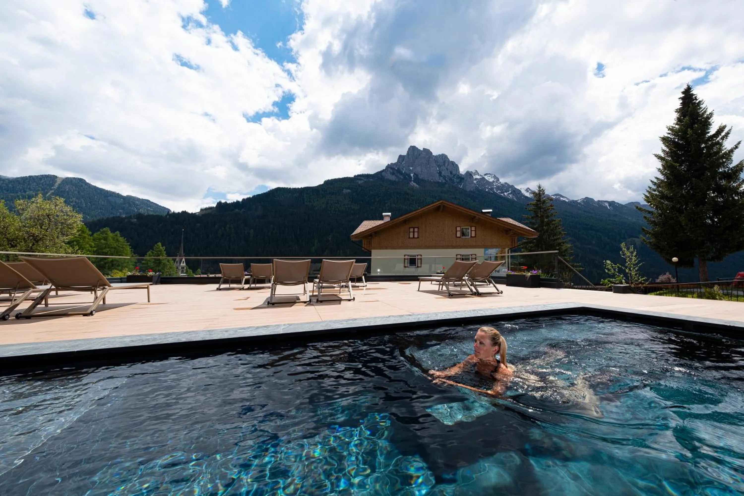 Swimming pool in Ciampedie Luxury Alpine Spa Hotel
