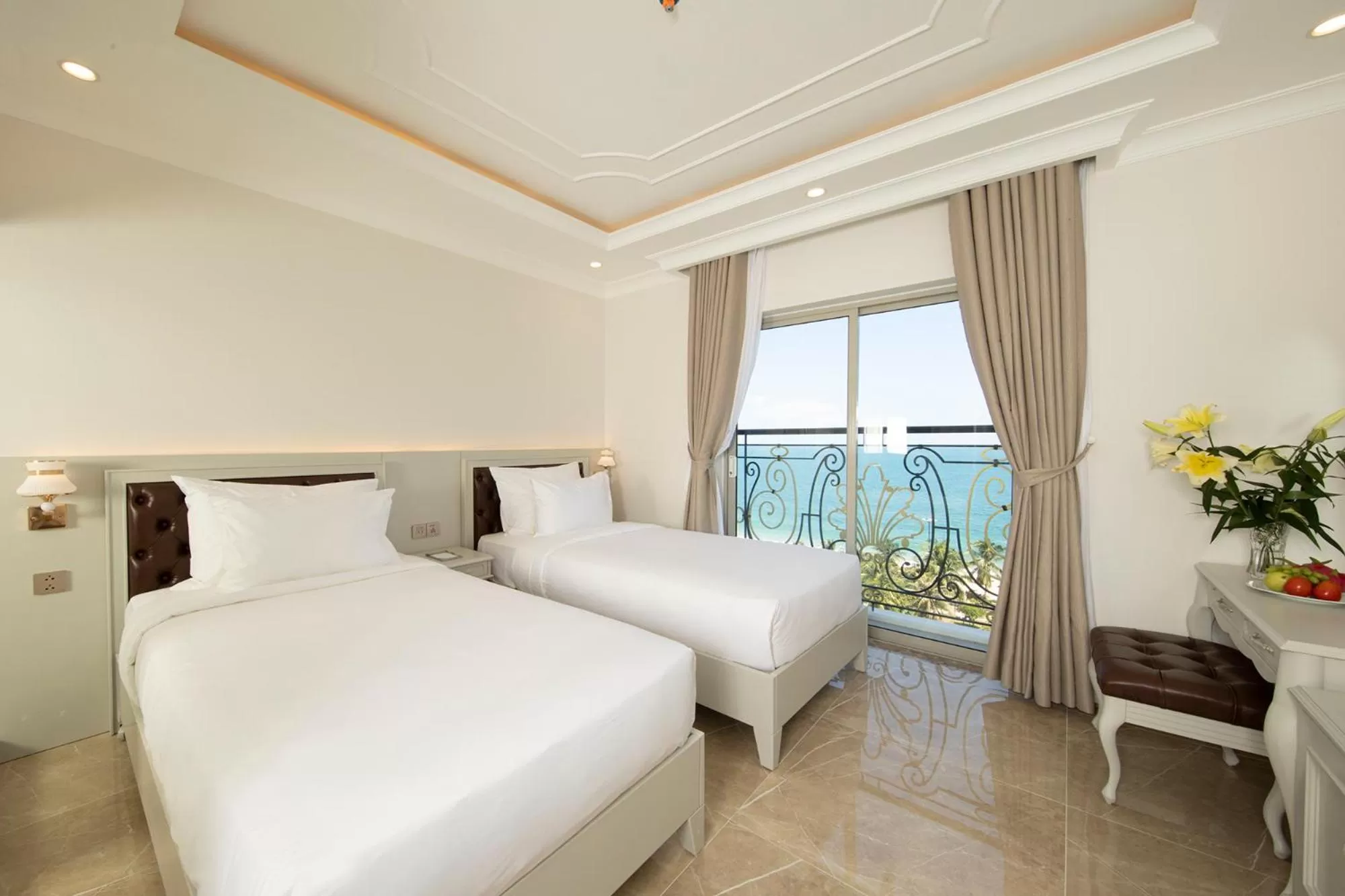 Bed in MerPerle Beach Hotel