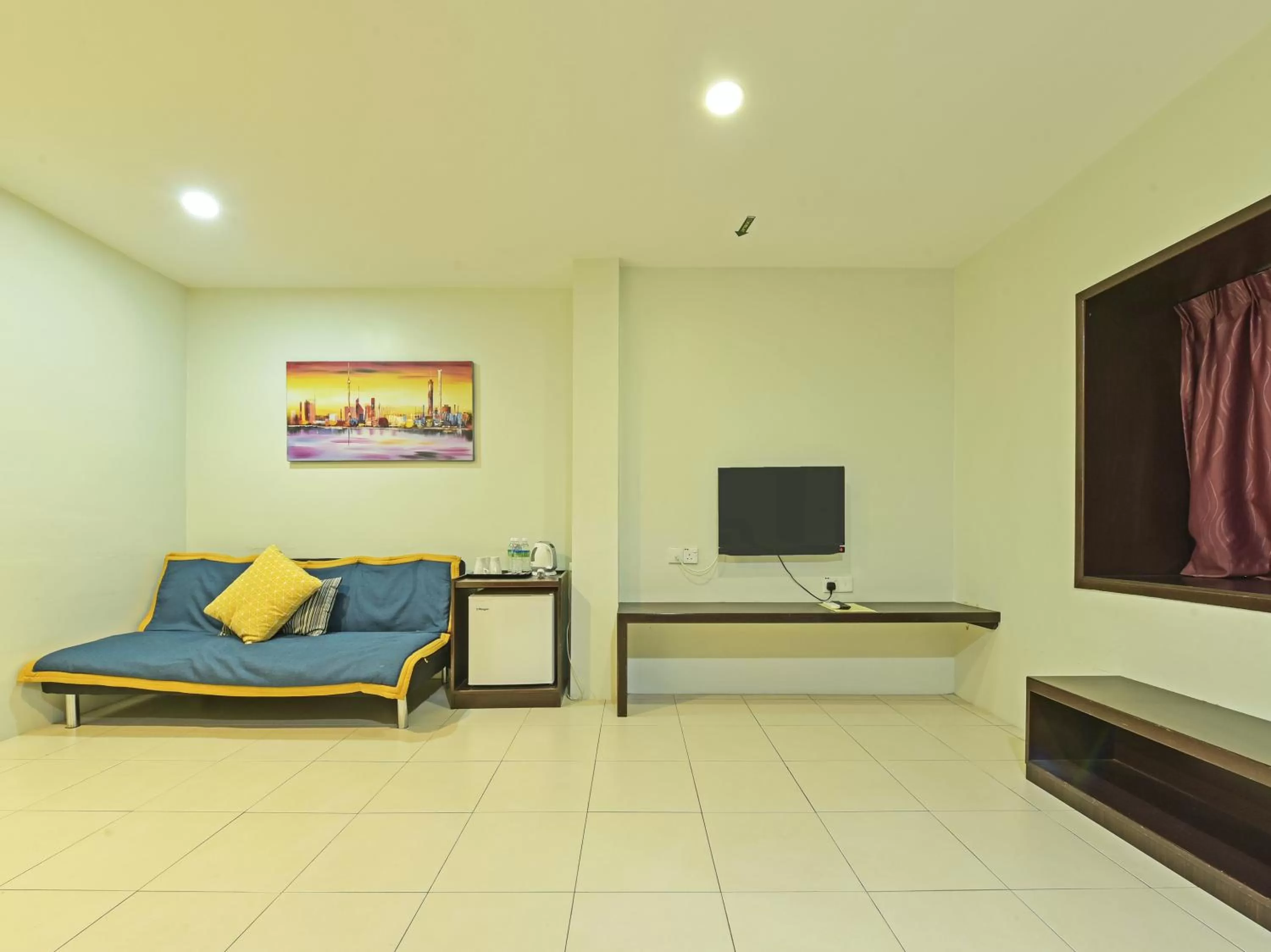 TV/Entertainment Center in Super OYO Capital O 90545 Ho Hotel