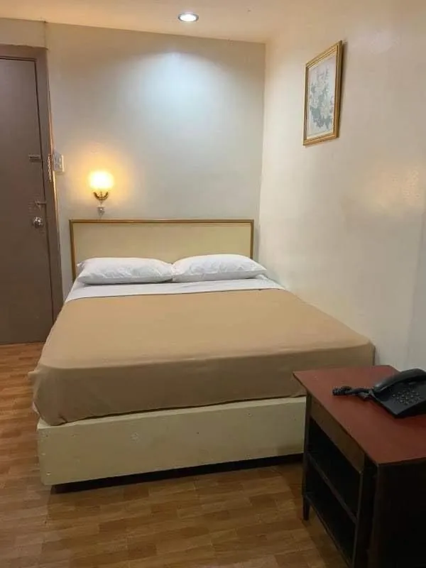 Bed in BEST FORTUNE HOTEL at CHINATOWN