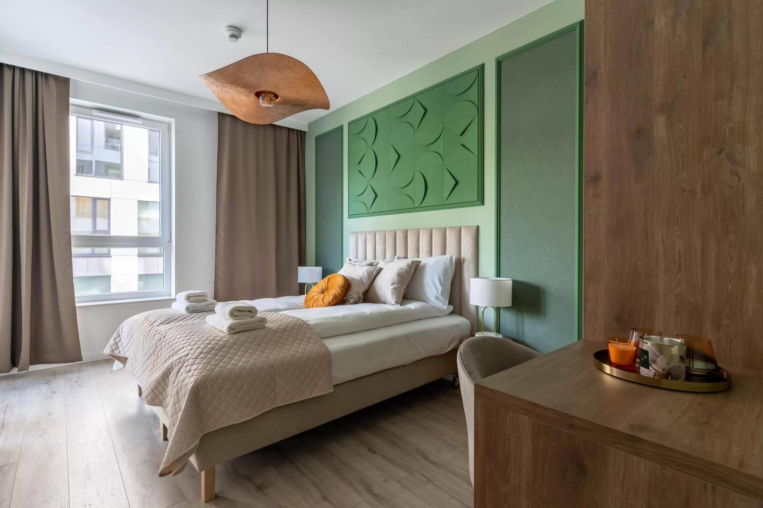 Bed in Symphony Modern Tower Apartamenty