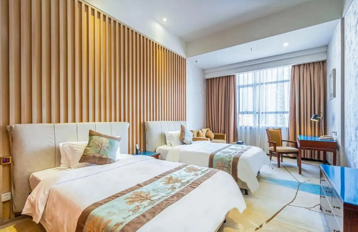 Bed in Guangzhou Nuomo International Hotel-Canton Fair Free Shuttle Bus