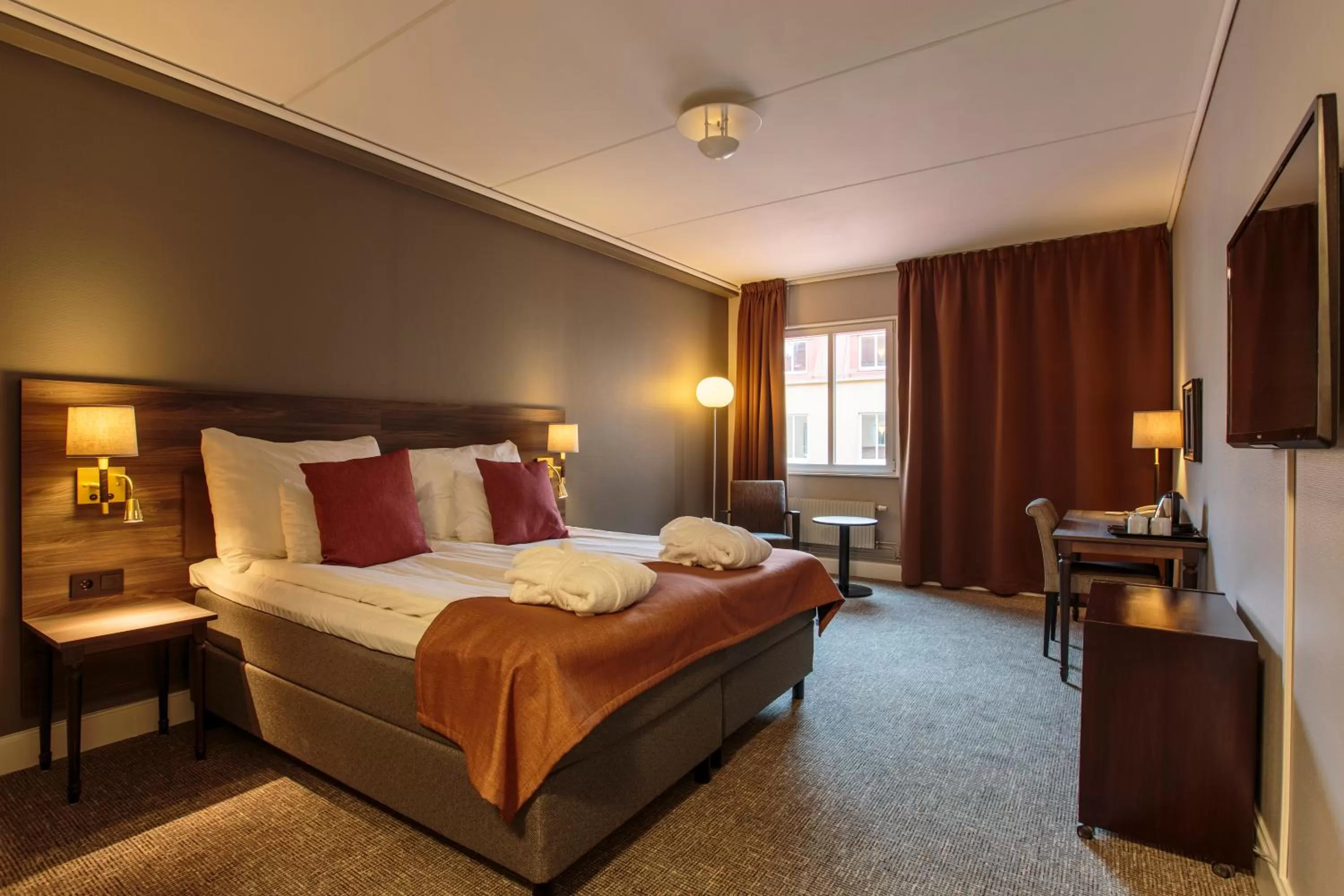 Bed in Clarion Collection Hotel Uman