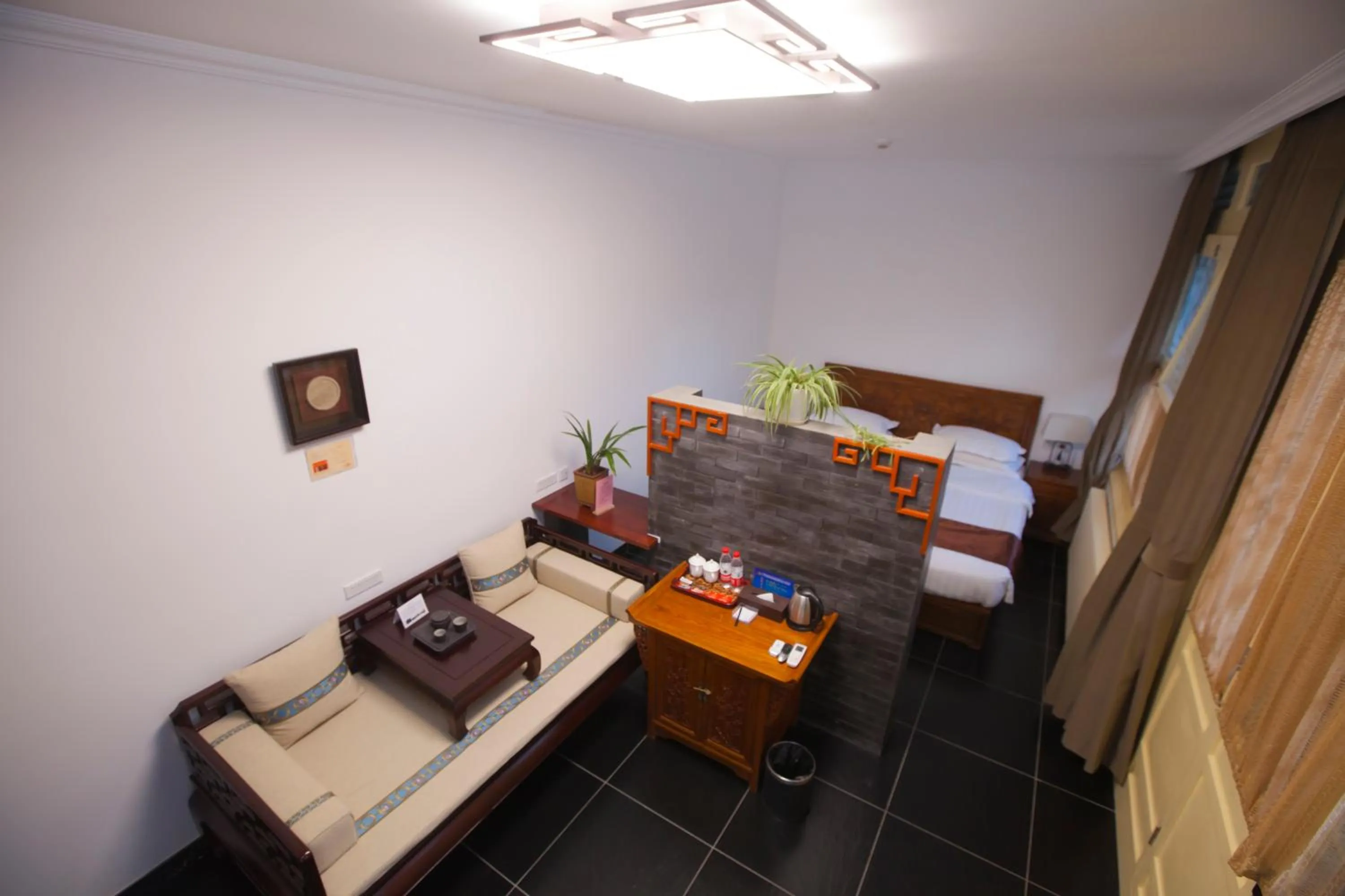 Bed in Beijing Jingyuan Courtyard Hotel