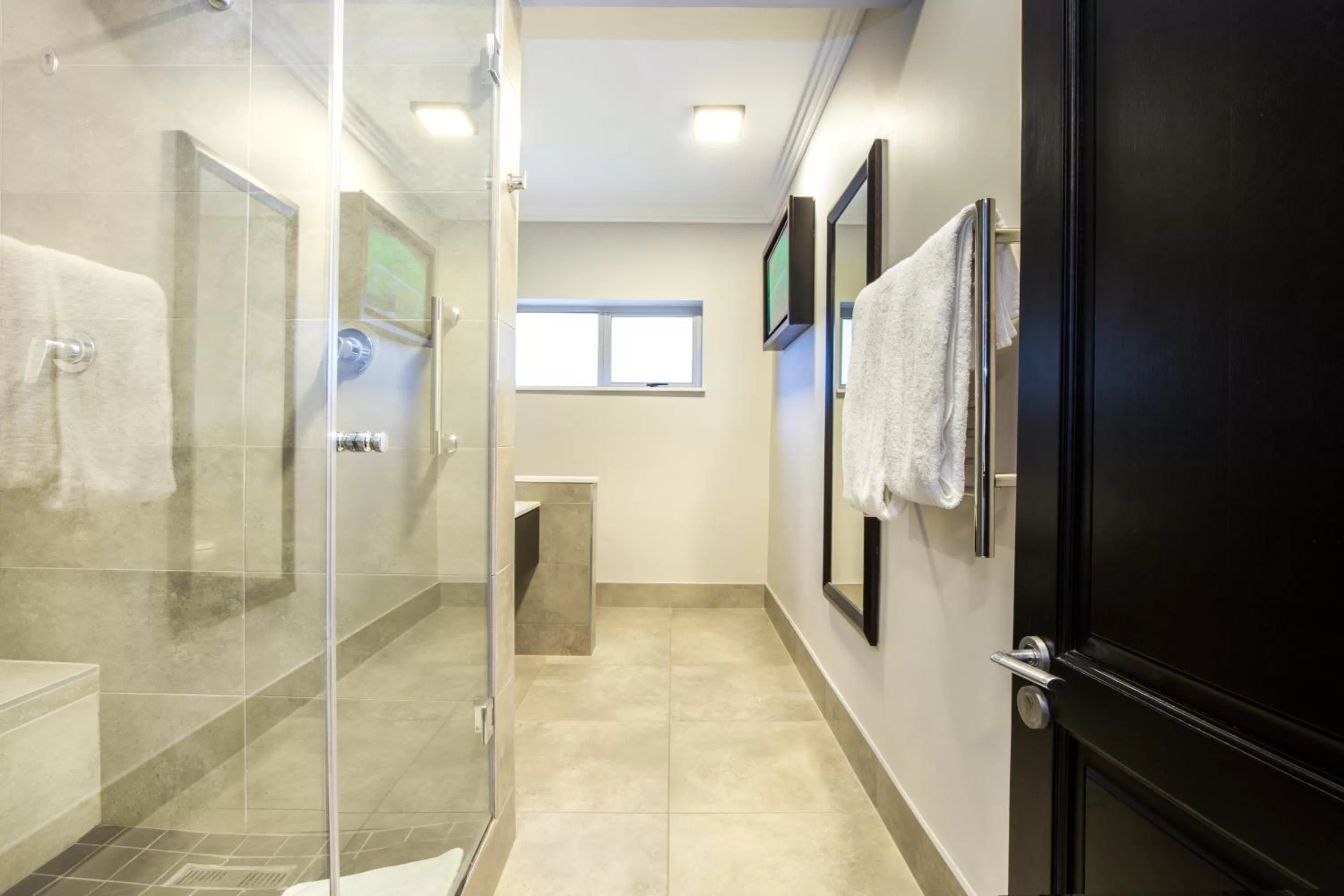 Bathroom in Belaire Suites Hotel