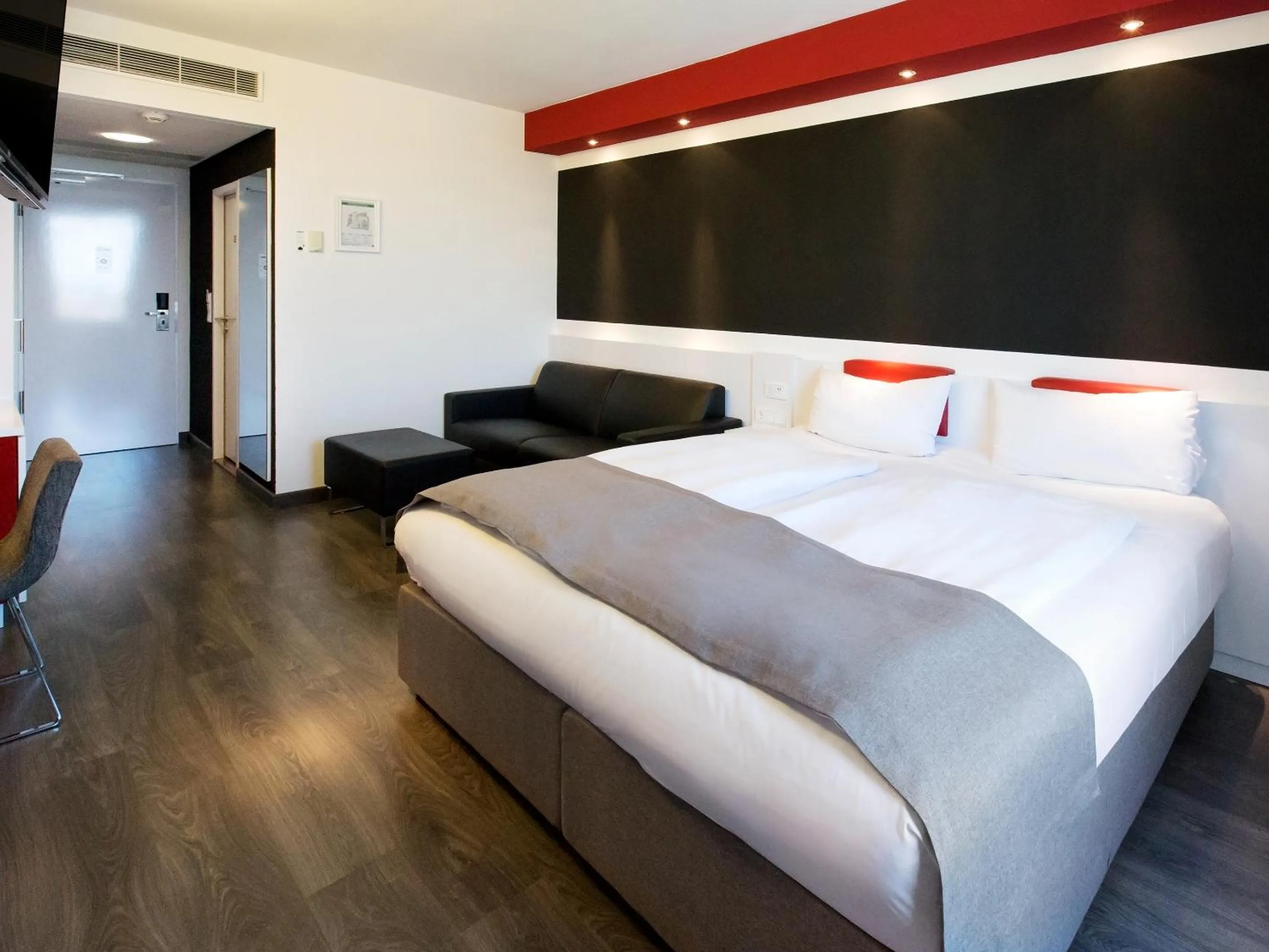 Photo of the whole room, Bed in DORMERO Hotel Stuttgart