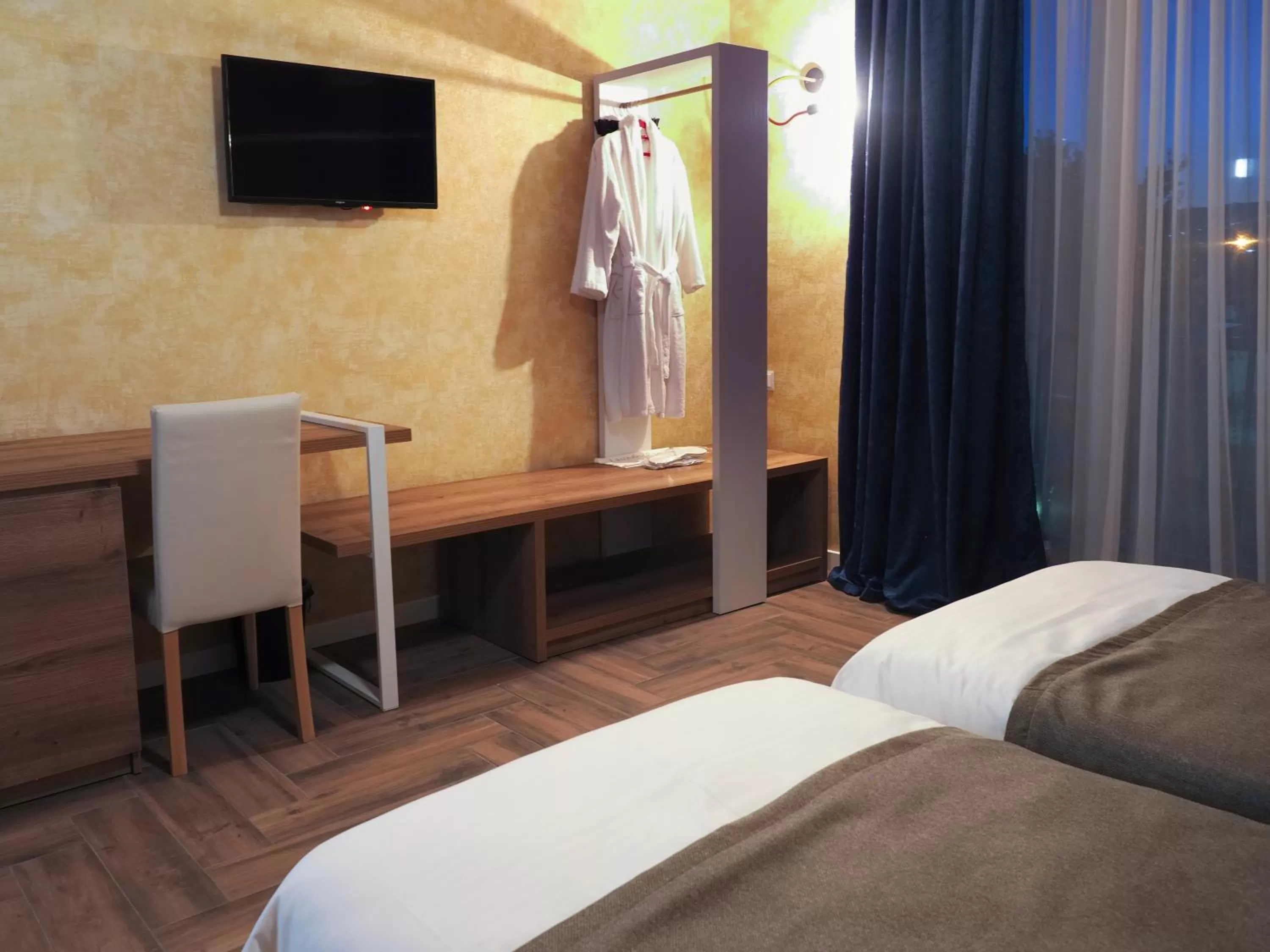 Bed, TV/Entertainment Center in Hotel BaniHills Tbilisi