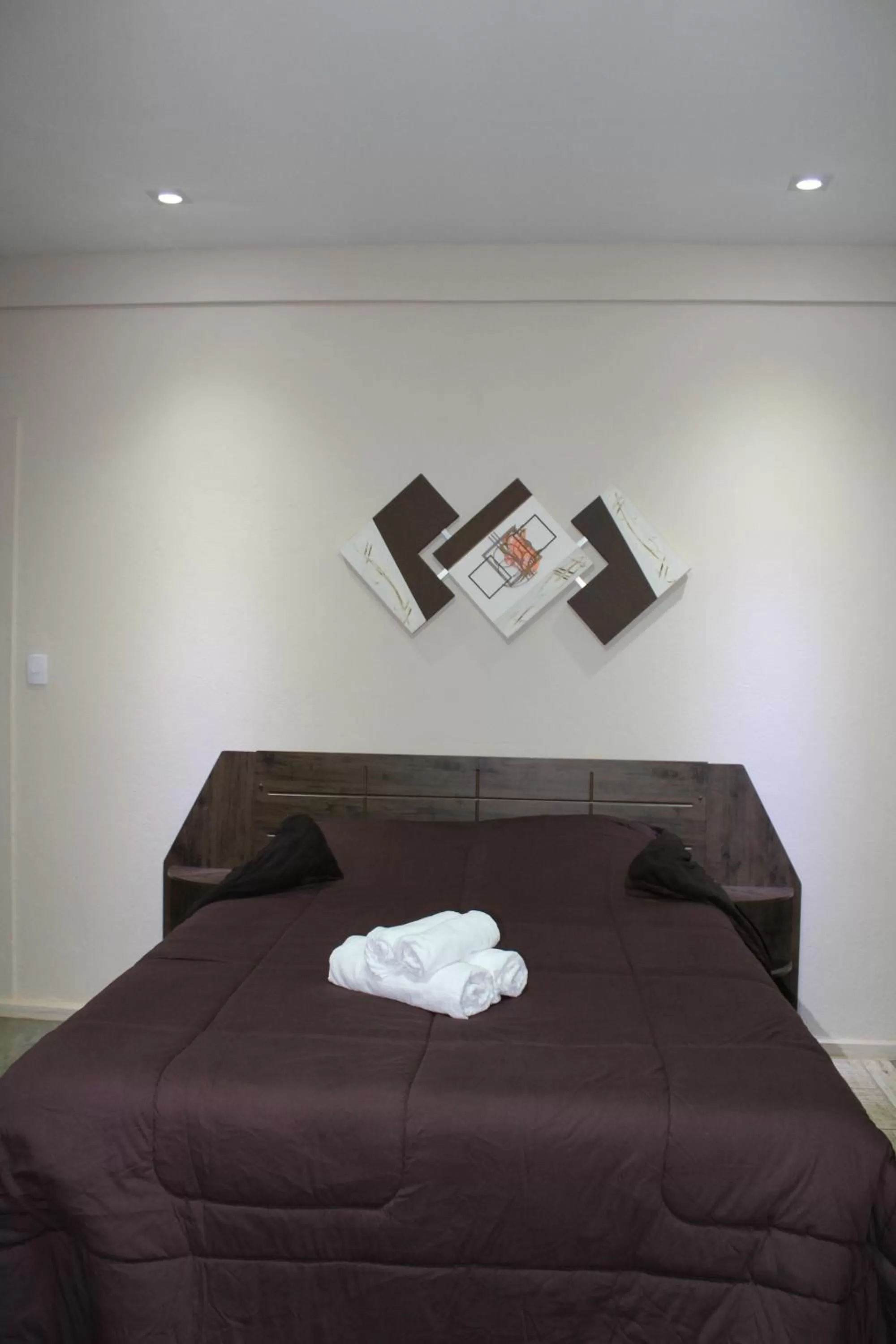 Bed in Pousada Morro dos Ventos