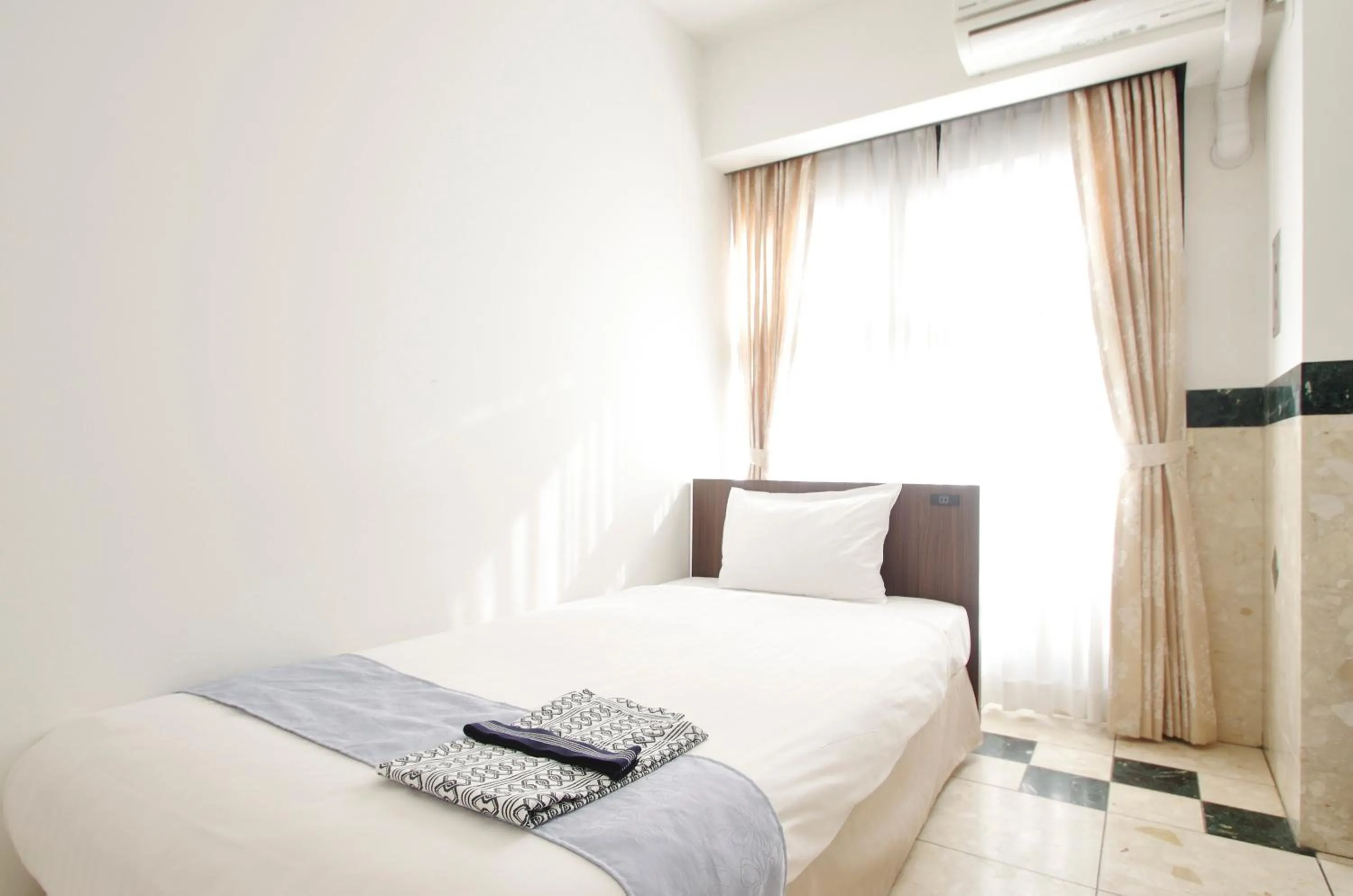 Bed in Hotel Imalle Yokohama Isezakicho