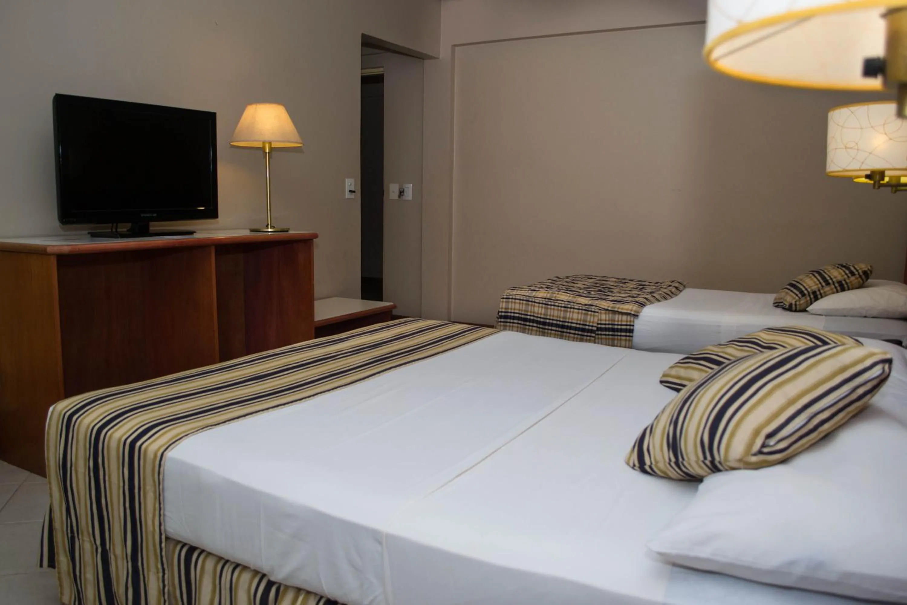 Bed in Marcopolo Suites Iguazu