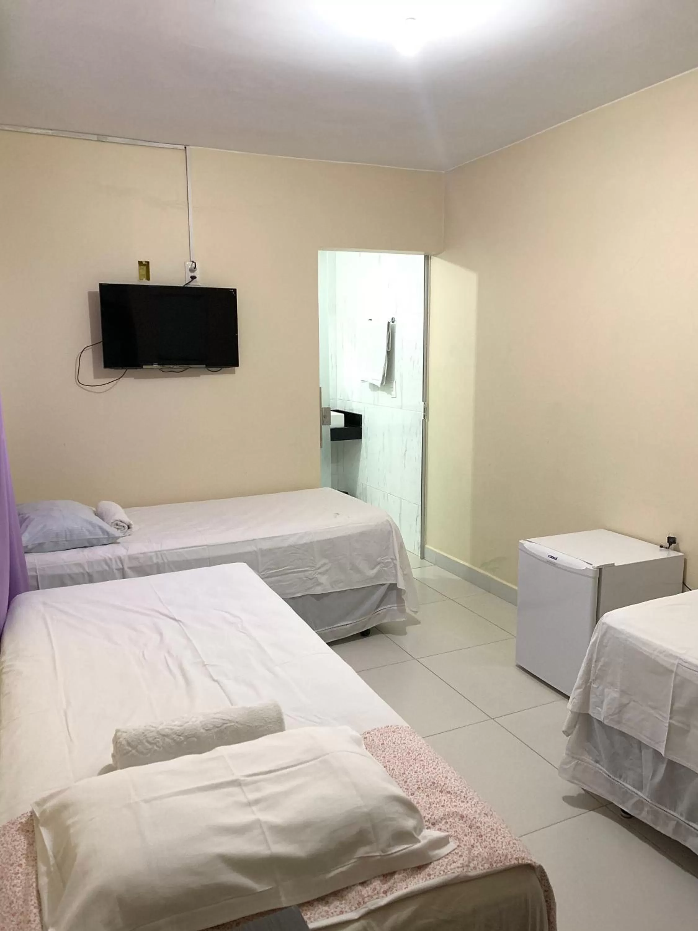 Bed in Pousada Jardim Brasília