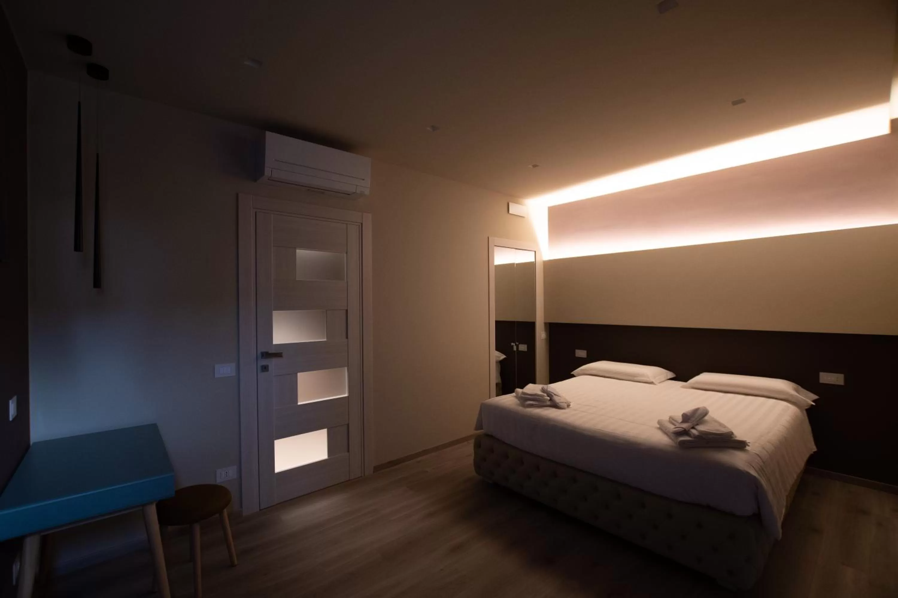 Bed in DiVino Rooms Deluxe