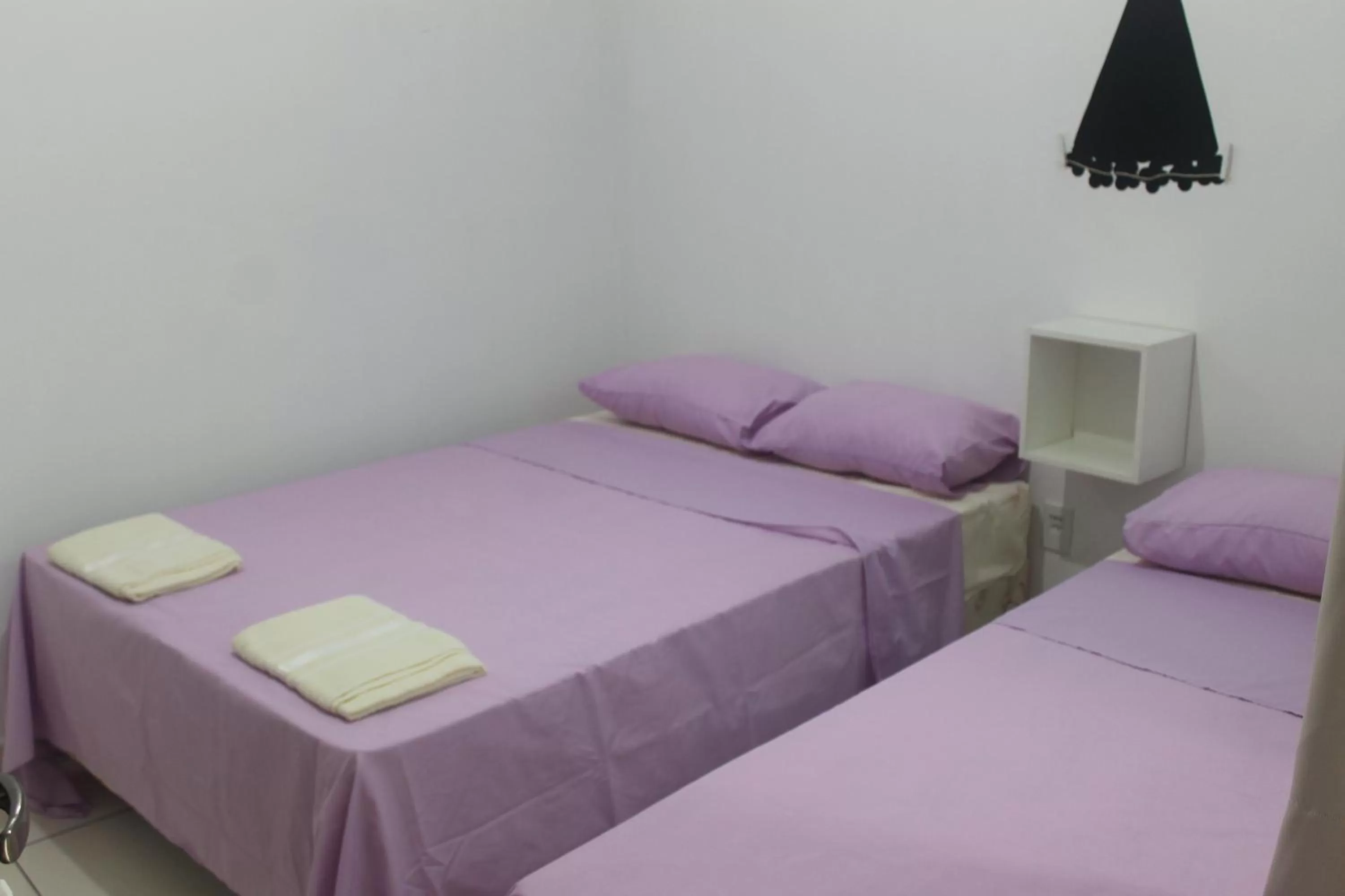 Bed in Pousada Orquideas de Maria