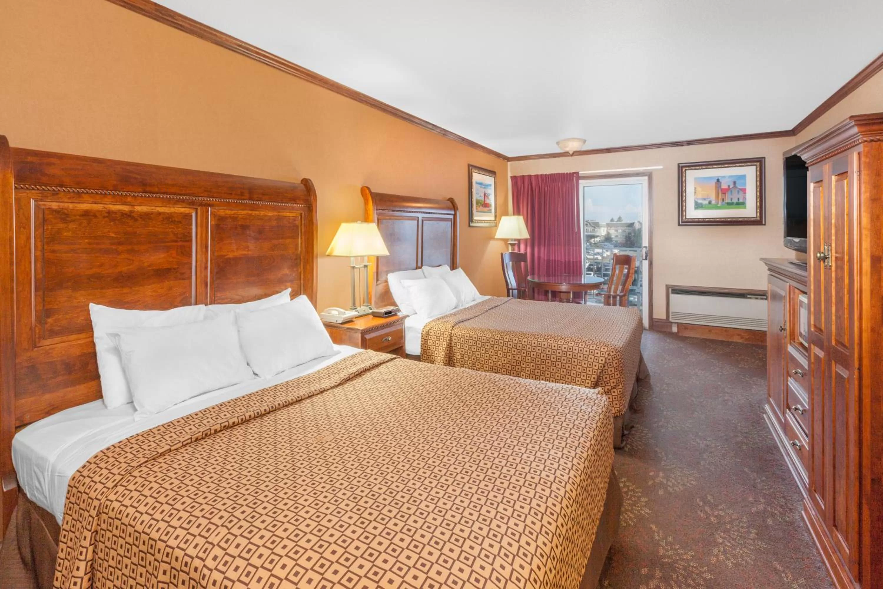 Bed in Ramada by Wyndham Mackinaw City Waterfront